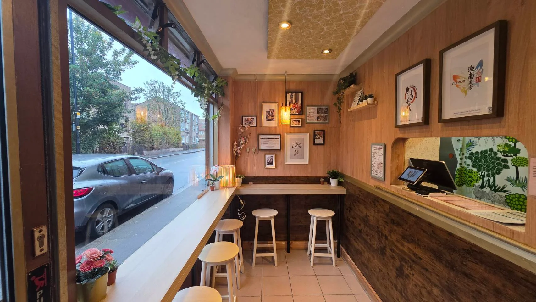 Cozy restaurant interior with wooden accents and bar seating