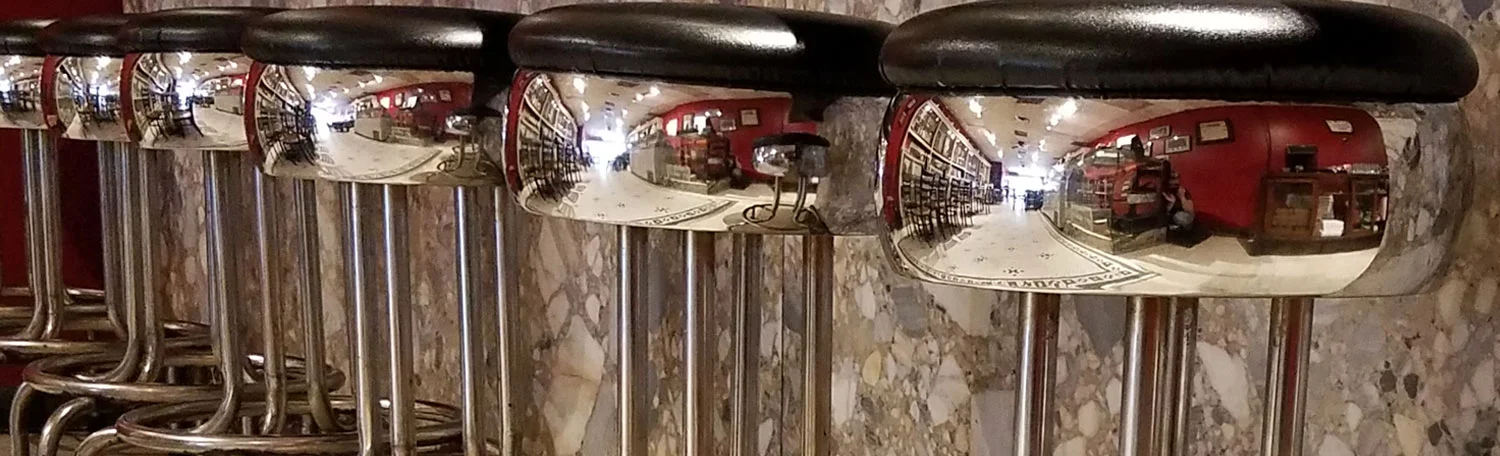Stylish bar stools reflecting a cozy restaurant interior