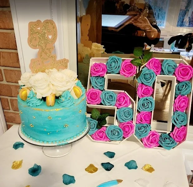 A beautifully decorated birthday cake with colorful frosting and candles.