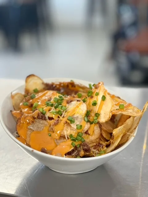 Loaded nachos with chicken and cheese sauce