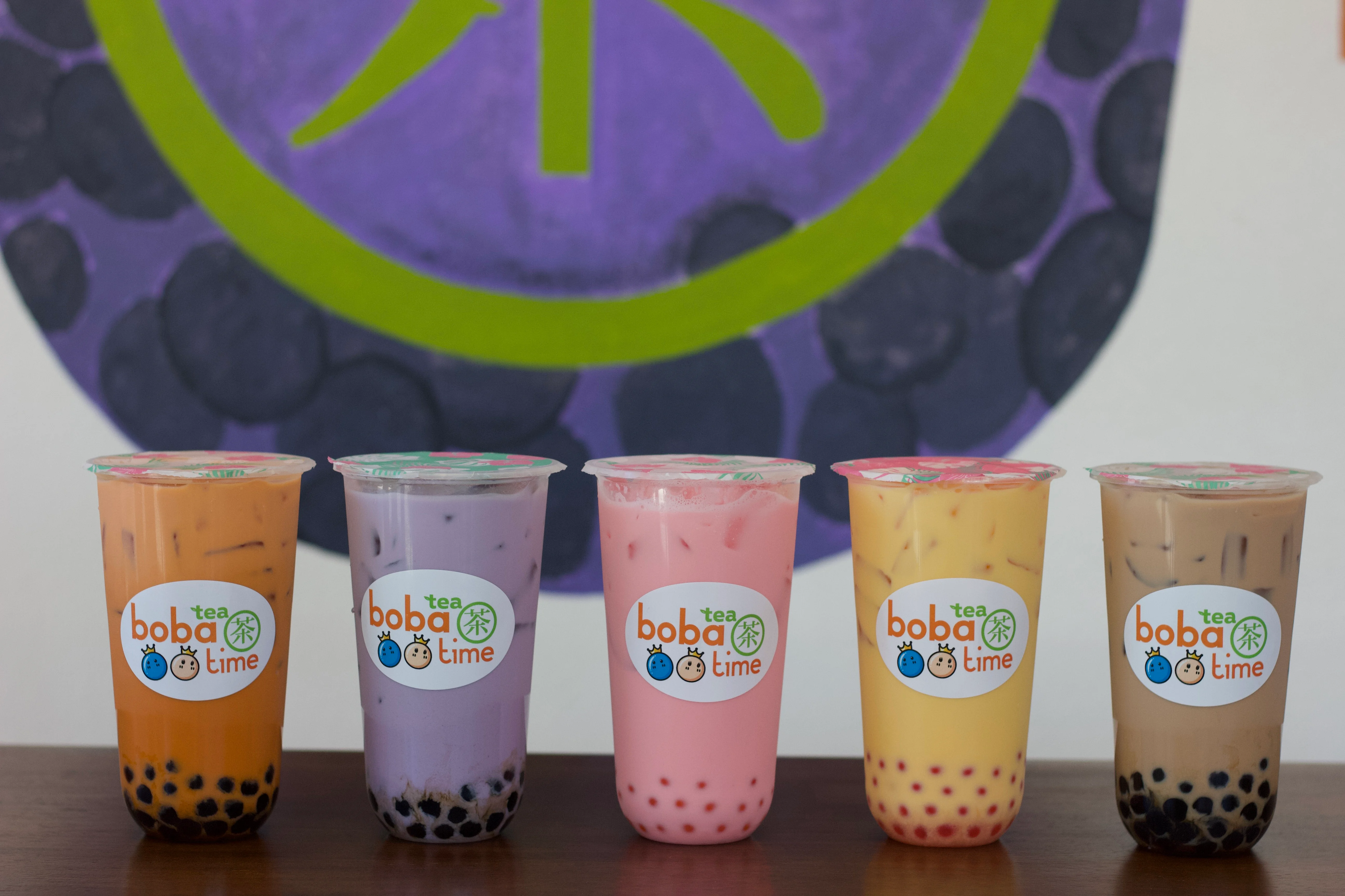 Colorful boba tea drinks with mango and passion fruit
