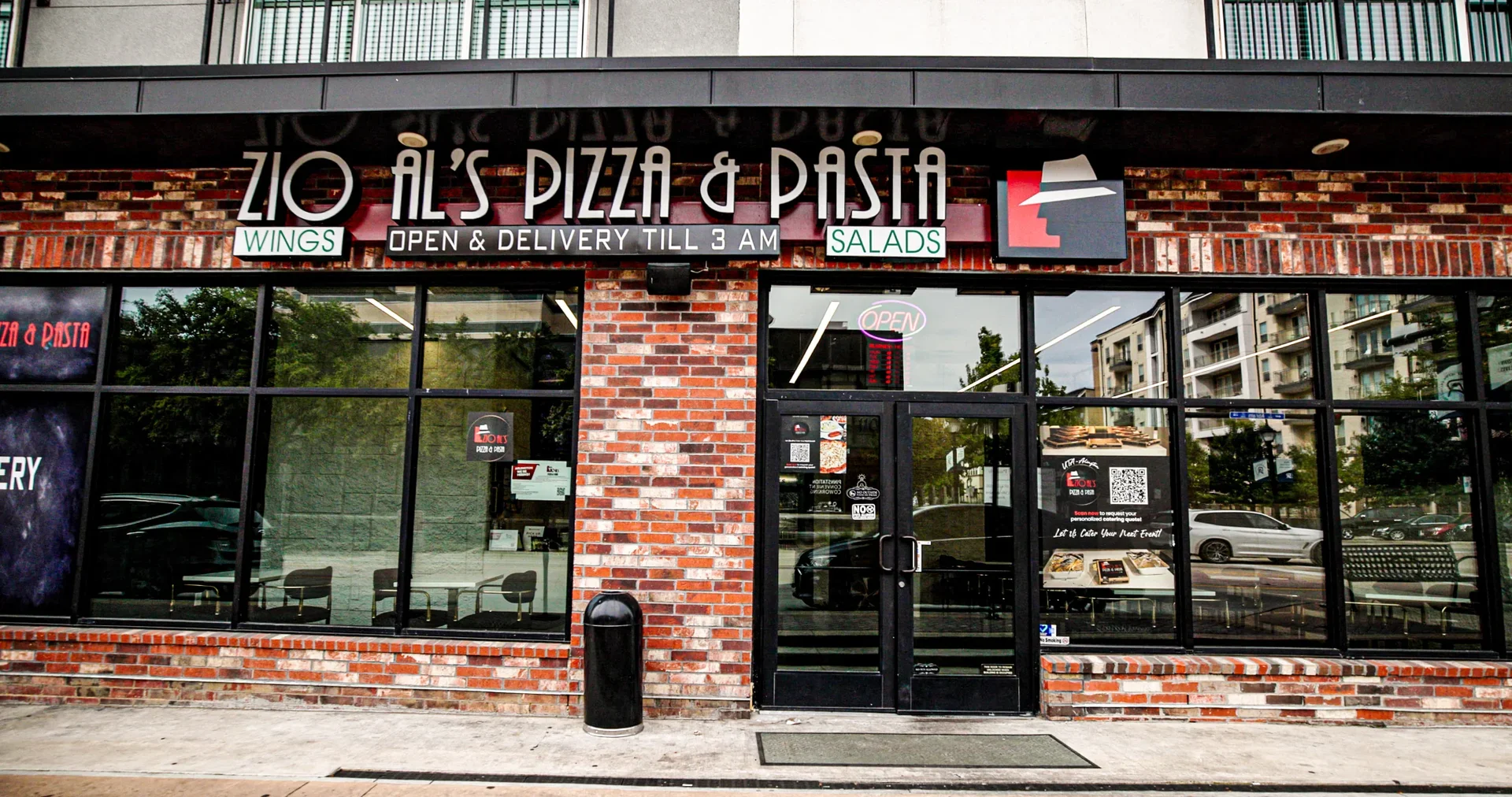 Exterior of Zio Al's Pizza & Pasta restaurant with open sign