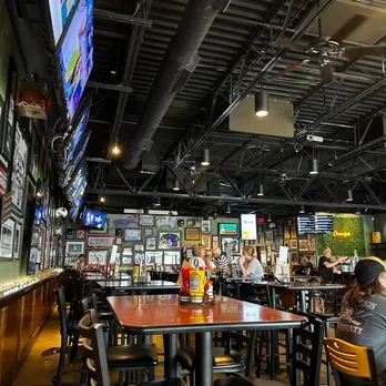 Casual restaurant interior with sports TVs and vibrant decor