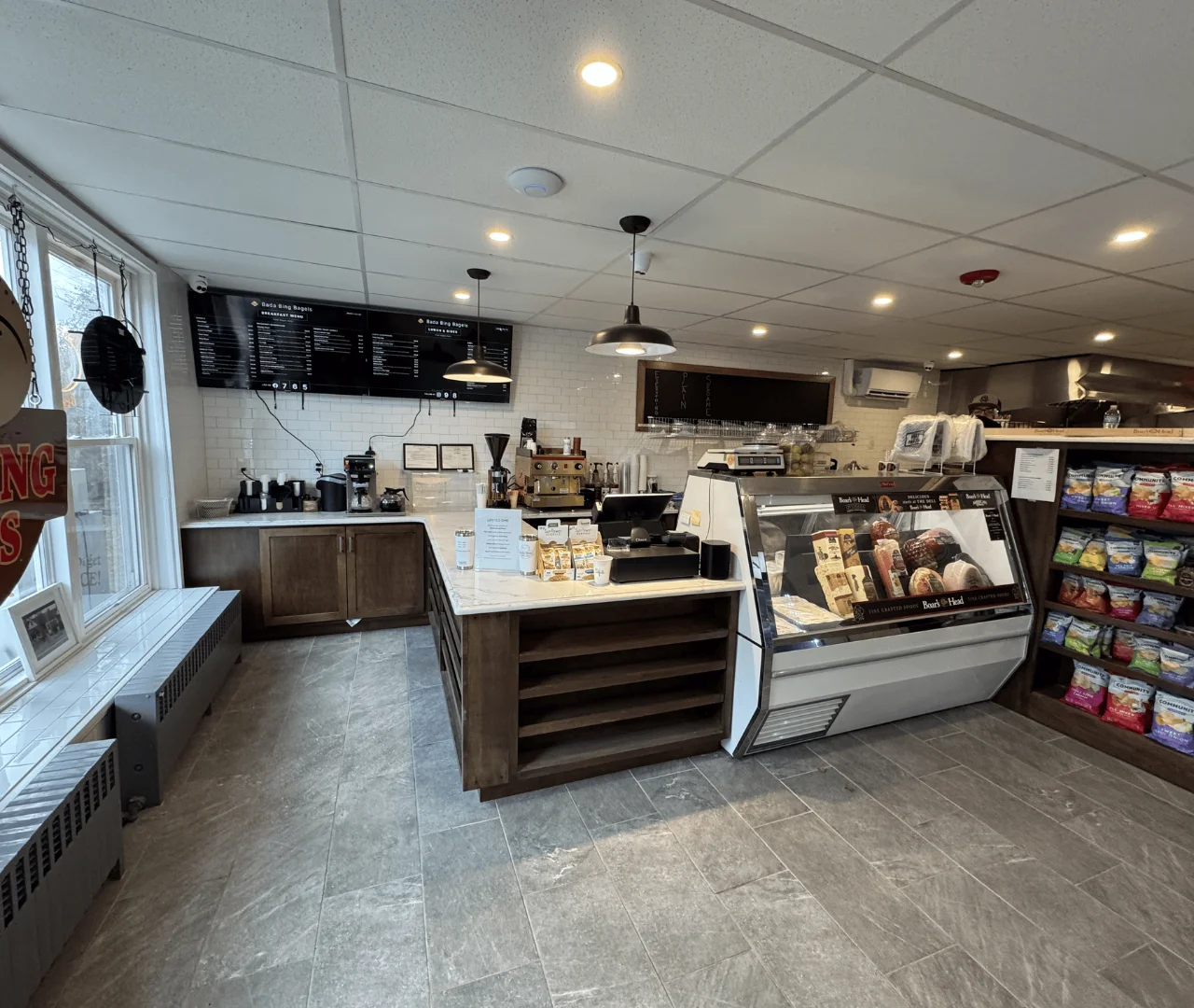 Modern café interior with coffee bar and display case