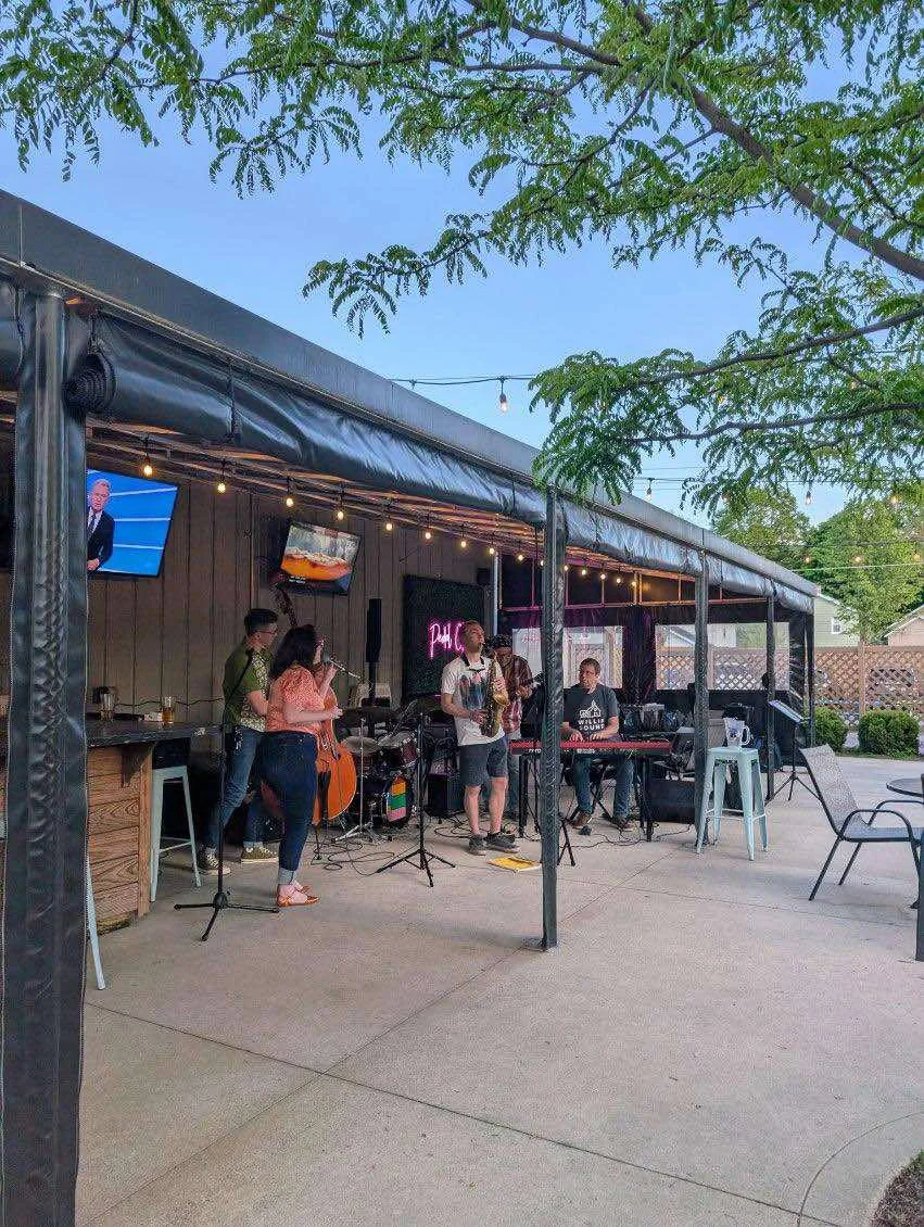 Live music performance at an outdoor restaurant patio
