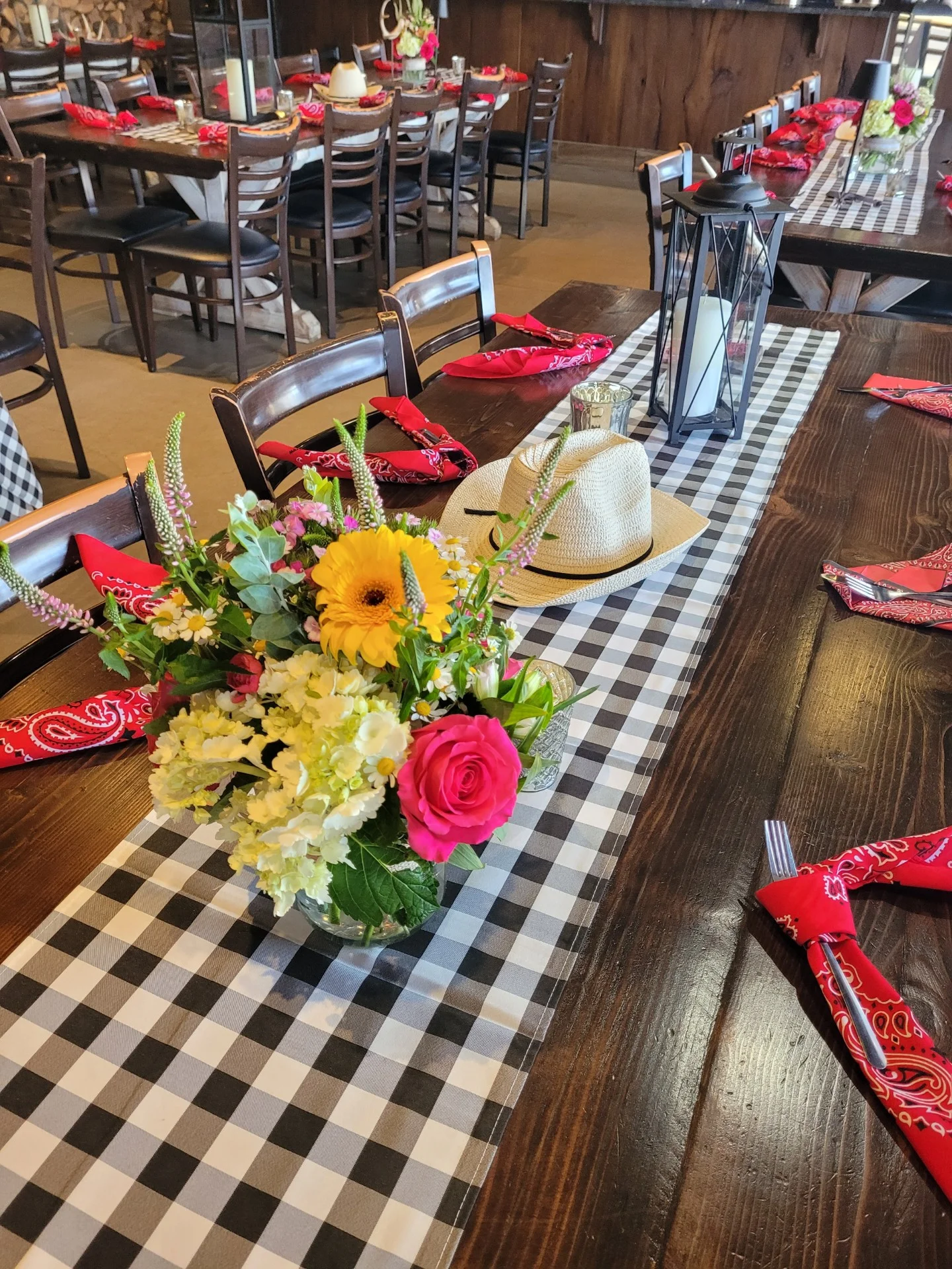 Elegant restaurant dining hall with modern decor and table settings.