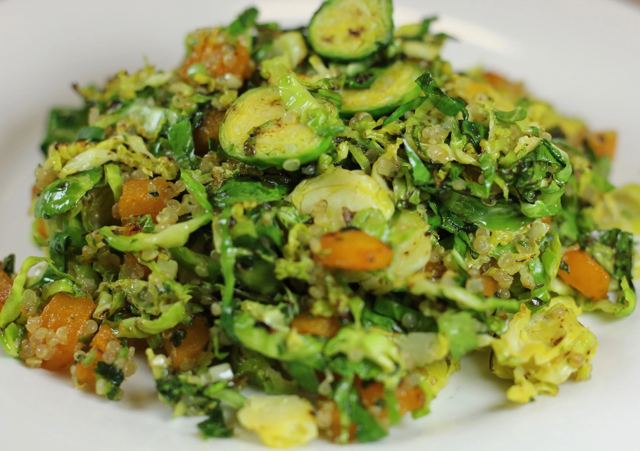 Vibrant quinoa salad with Brussels sprouts and seasonal greens