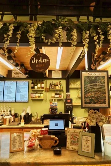 Cozy café counter with floral decor and menu displays