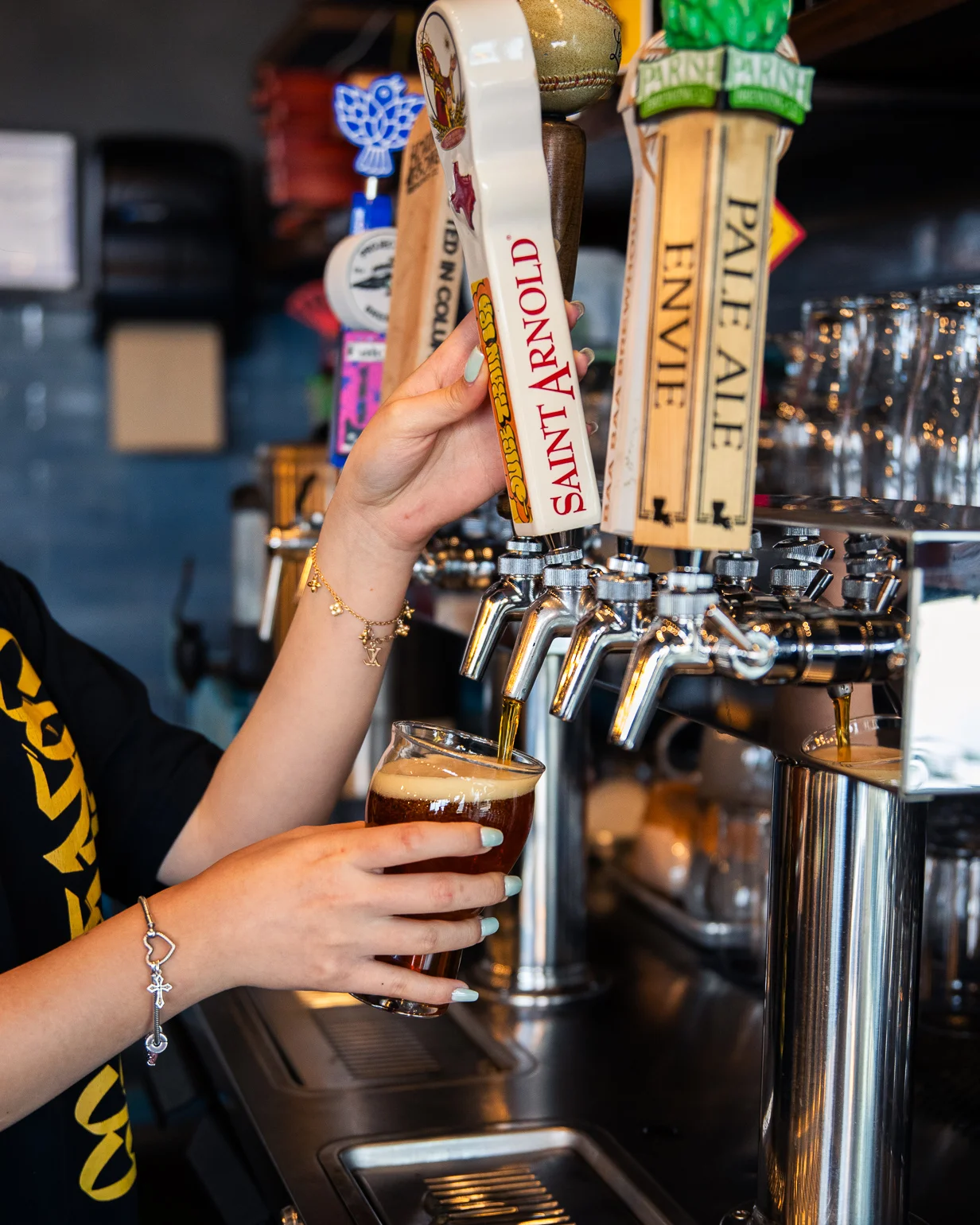 Bartender pouring draft beer at a restaurant bar