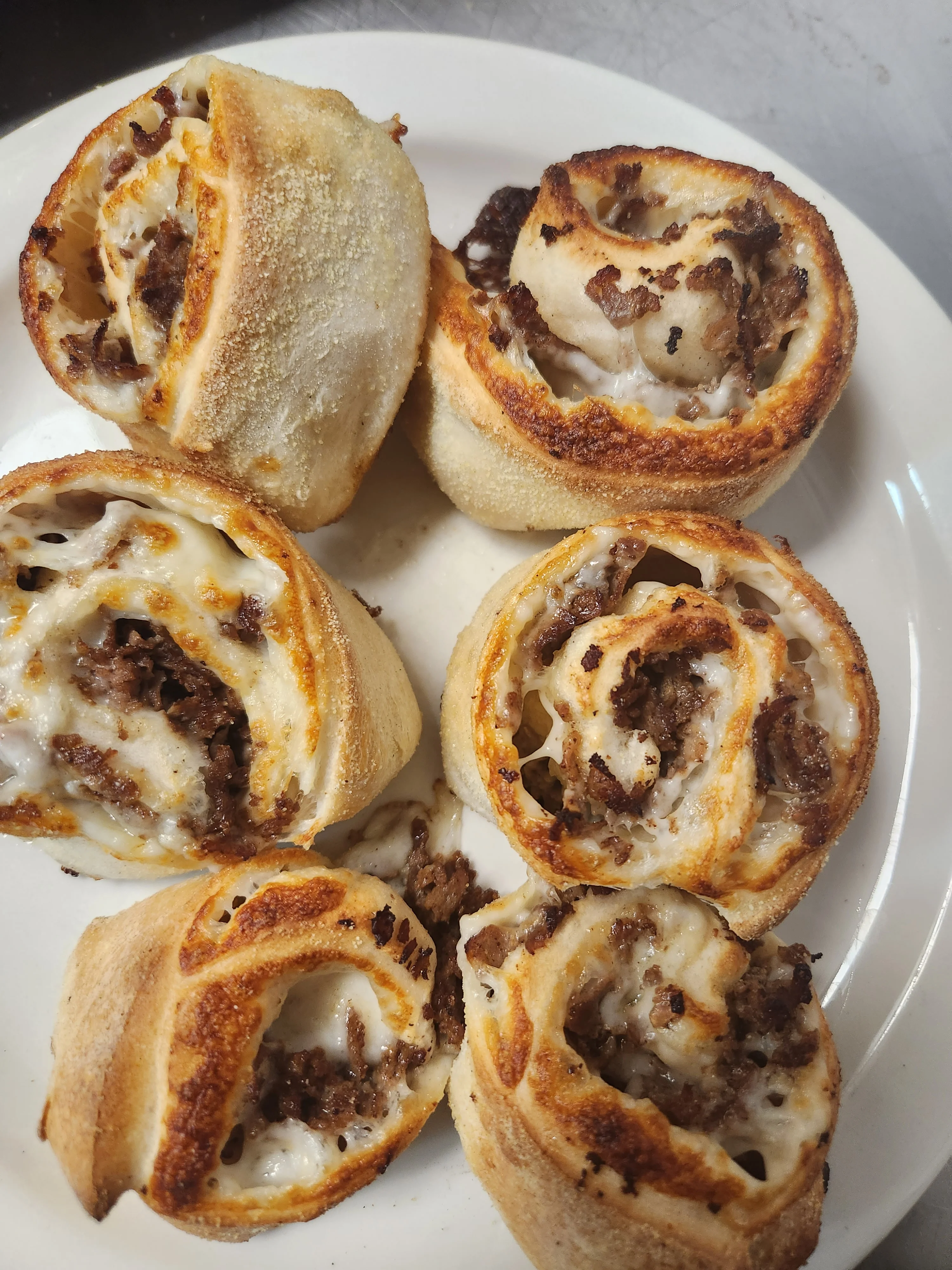 Savory beef rolls with melted cheese, a popular comfort food