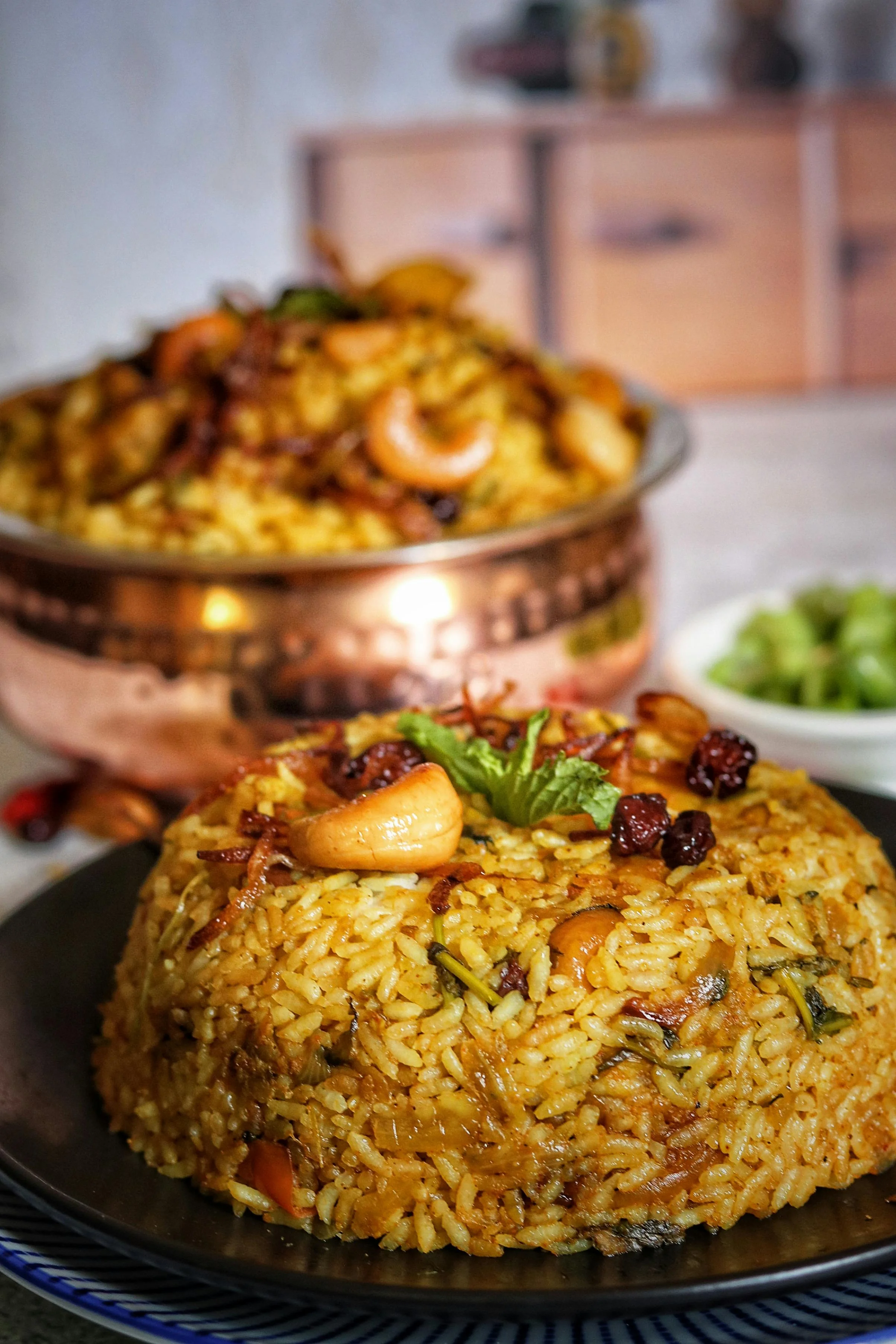 Delicious Indian biryani garnished with nuts and herbs