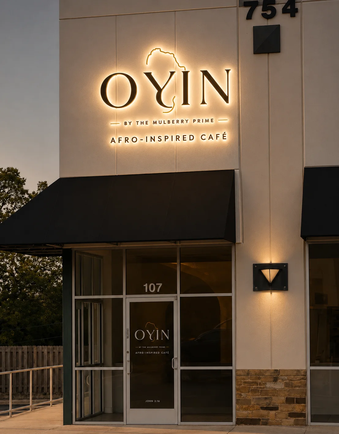 Exterior view of OYIN Afro-Inspired Café with illuminated signage.