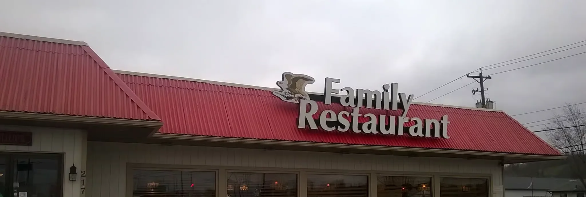 Family restaurant exterior with red roof and welcoming signage