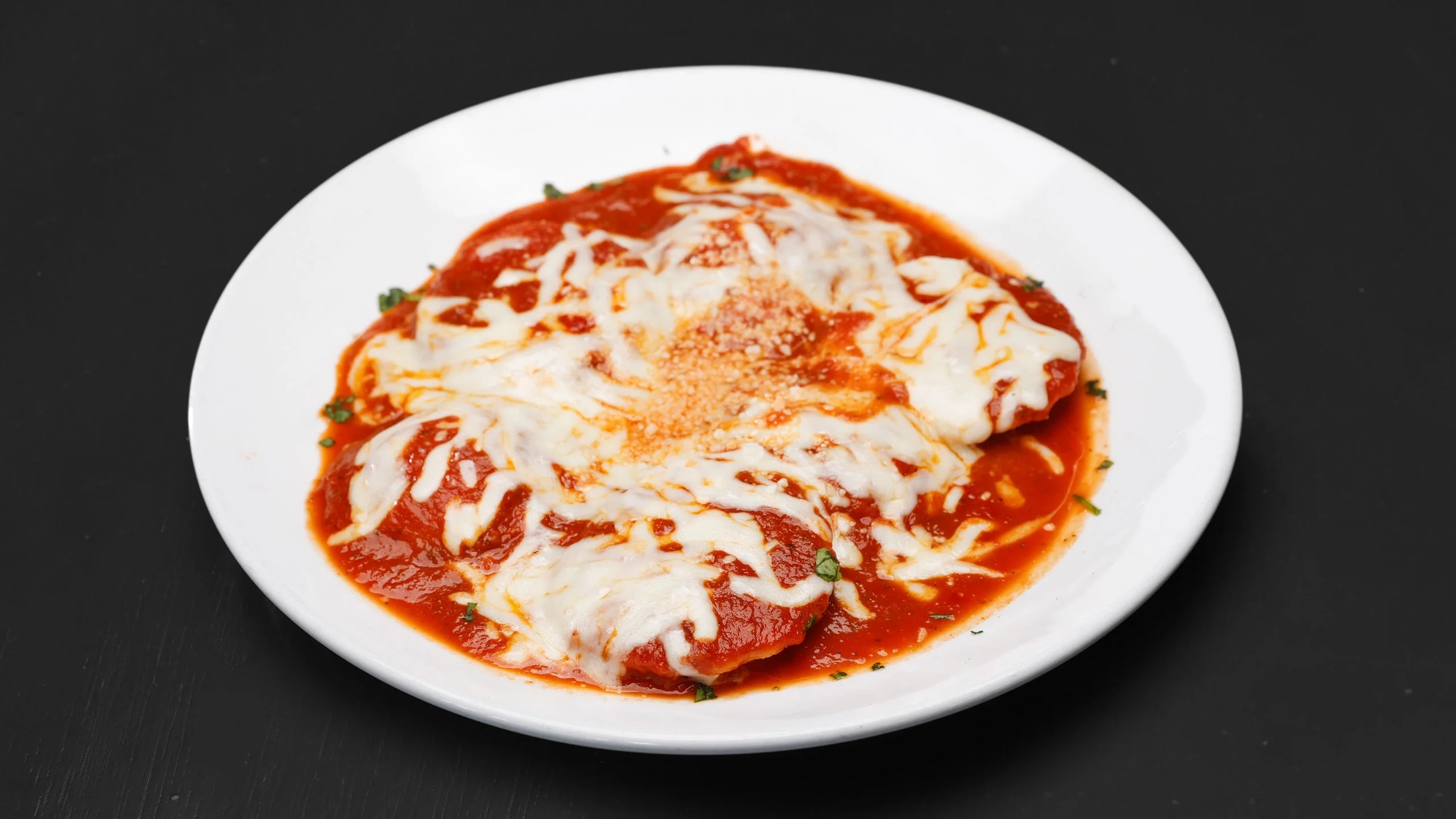 Cheesy Italian eggplant parmesan in marinara sauce