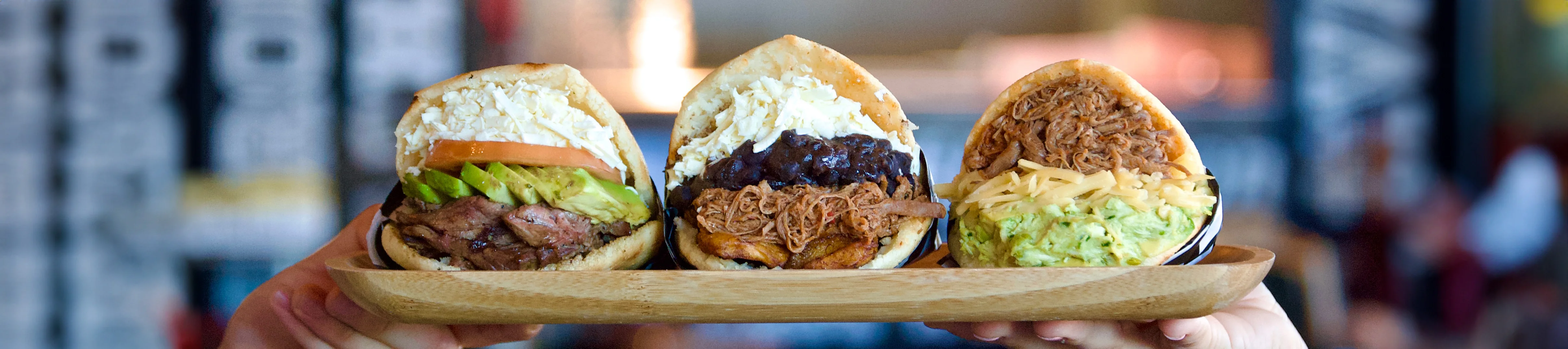 Assorted arepas with various fillings from Latin American cuisine