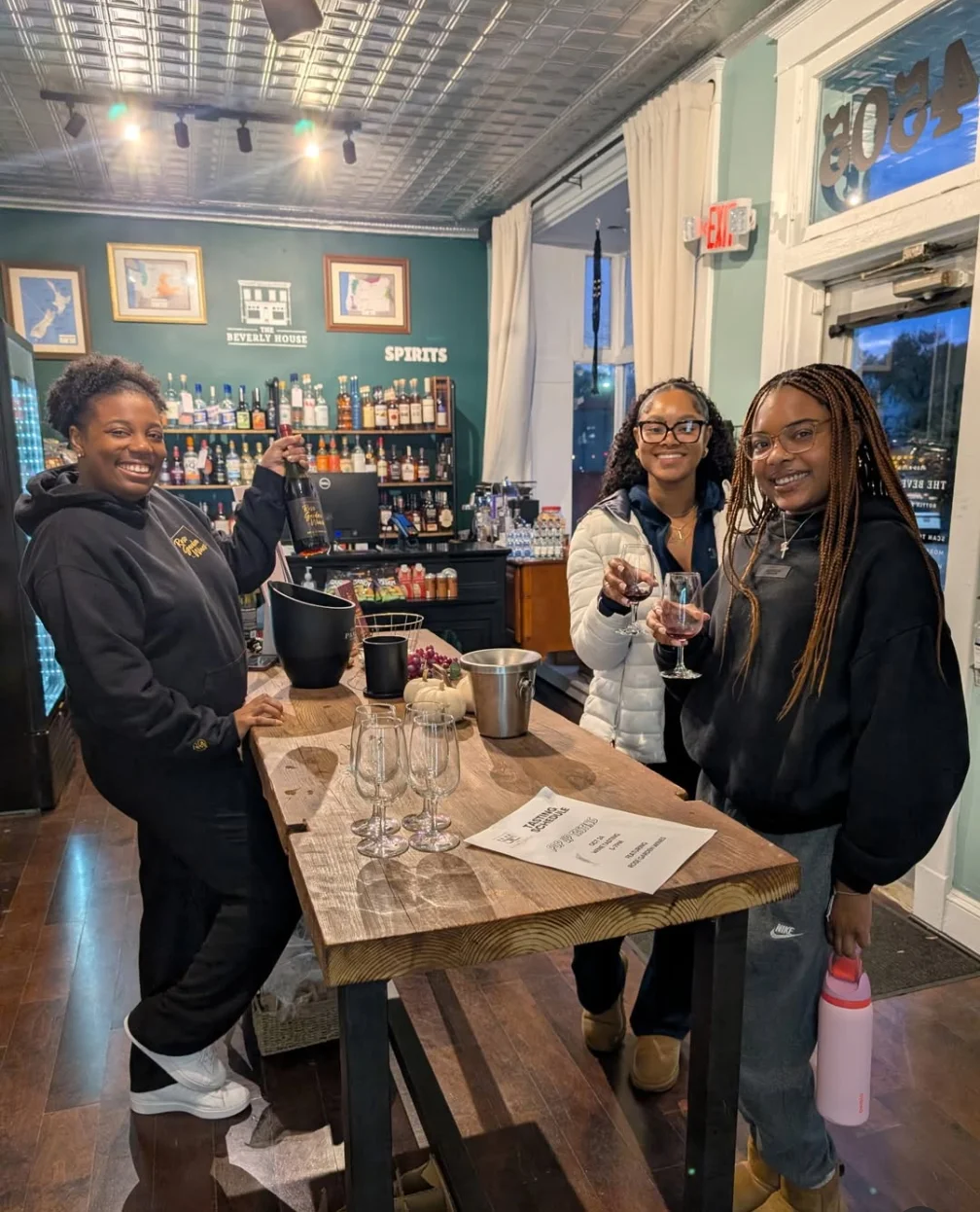 Bartenders serving drinks in a vibrant bar setting