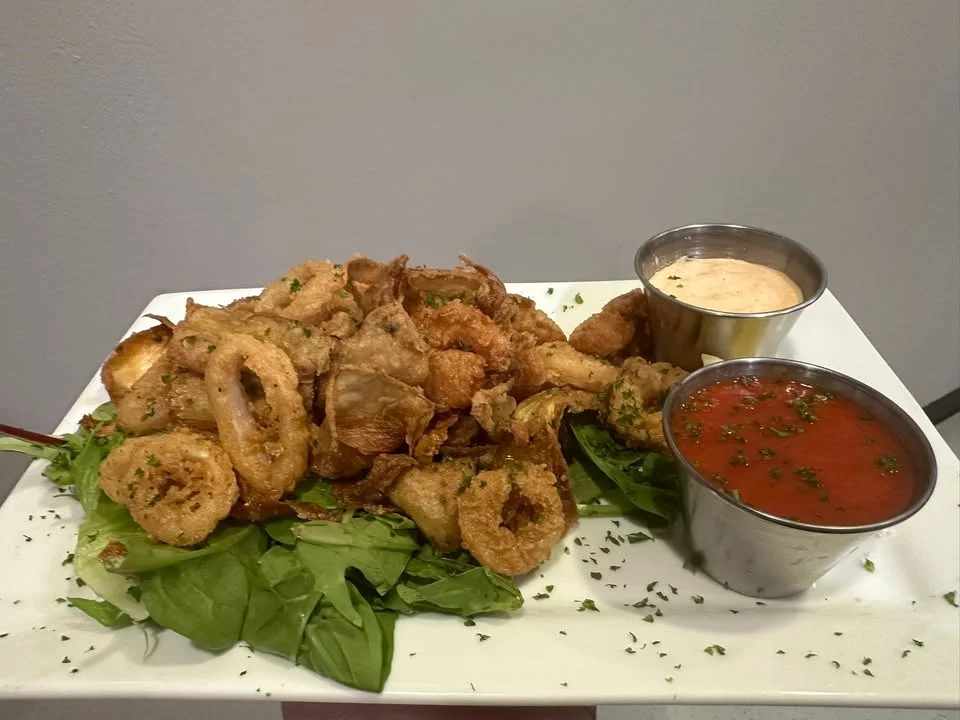 Fried calamari platter with dipping sauces
