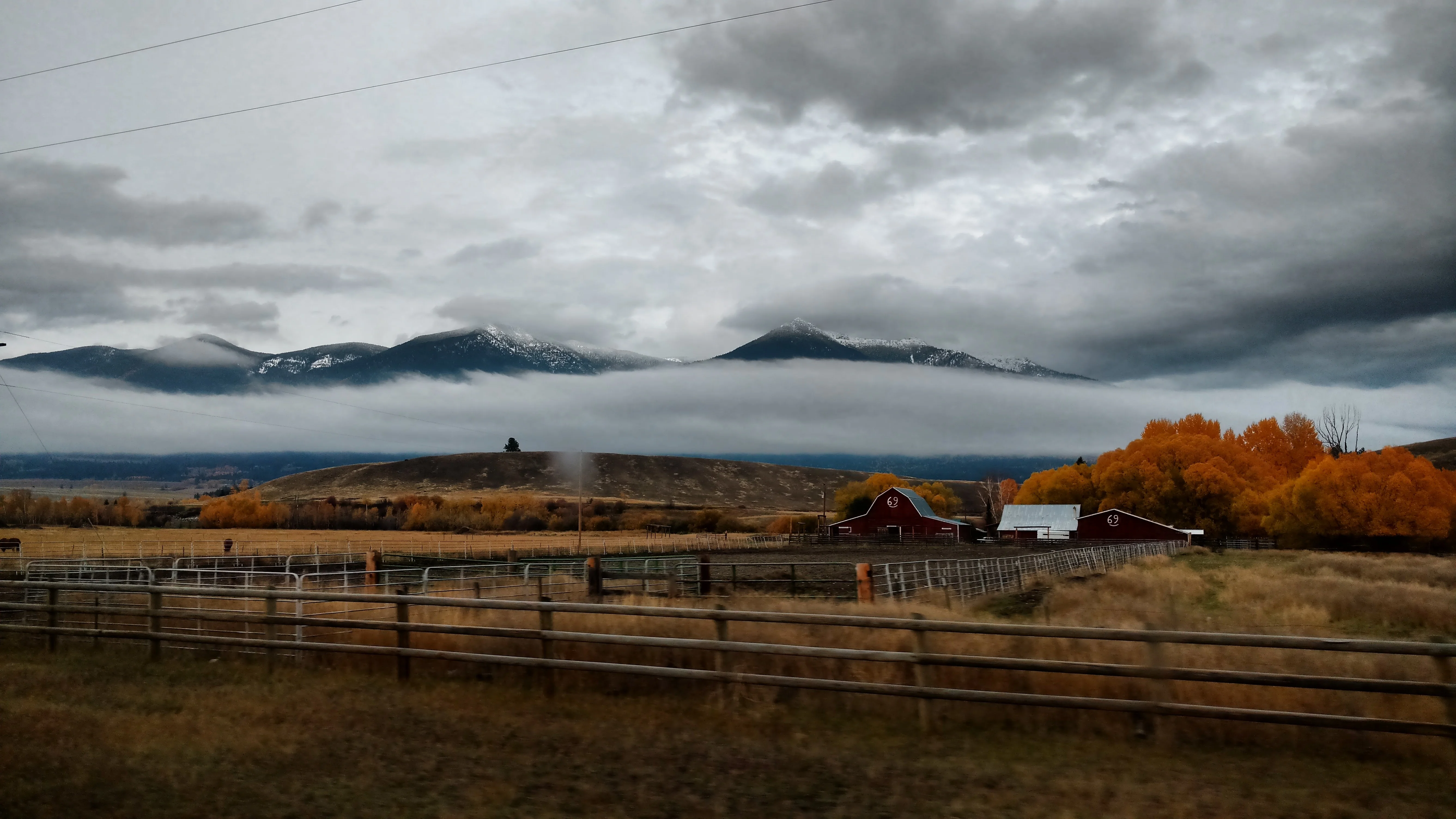 Scenic view of mountains and autumn trees in a rural landscape