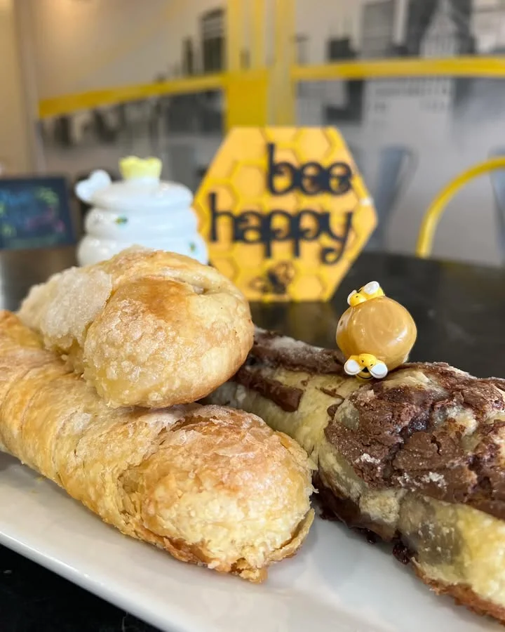 Assorted pastries on a plate in a cozy café setting