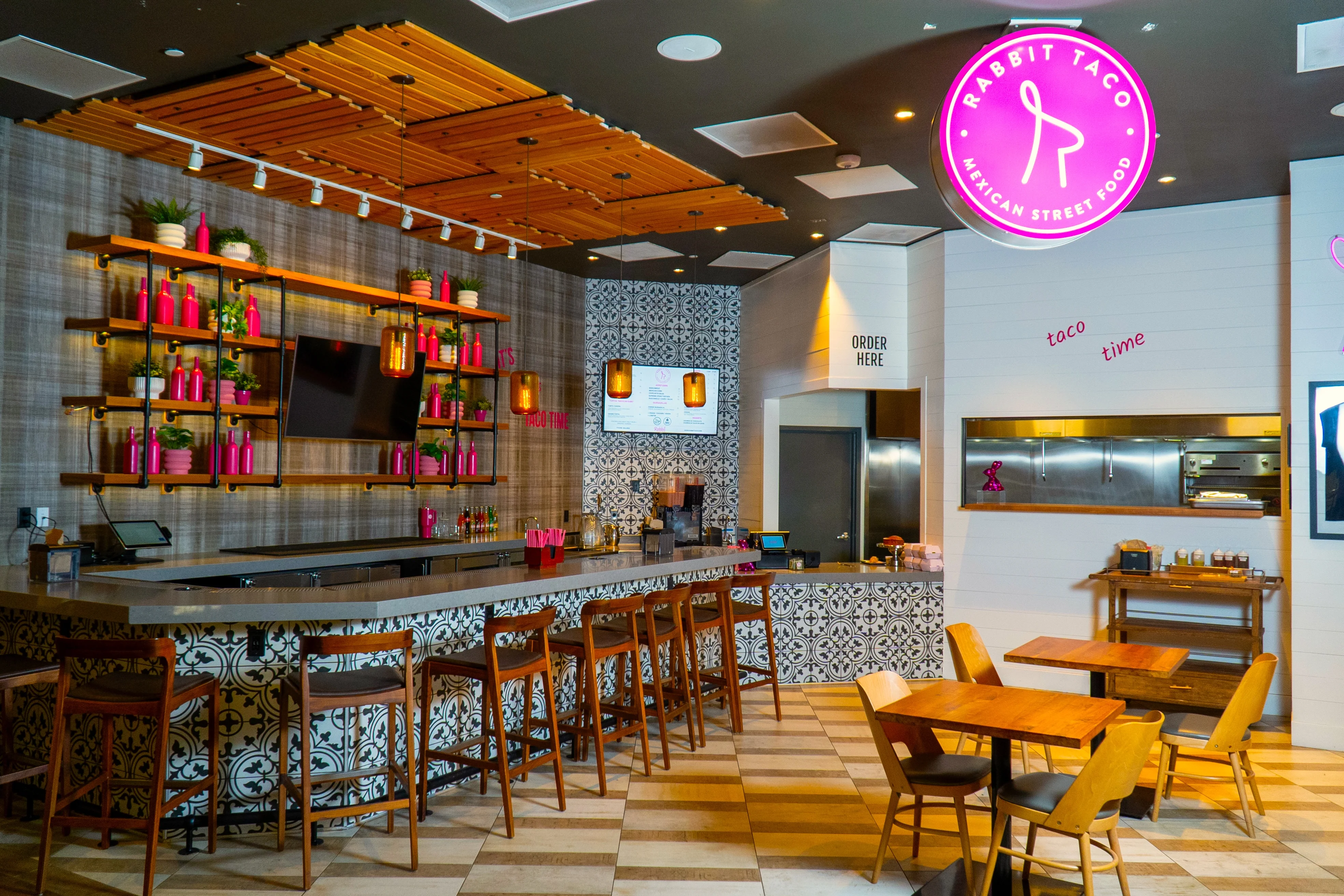 Vibrant restaurant interior with modern decor and bar area
