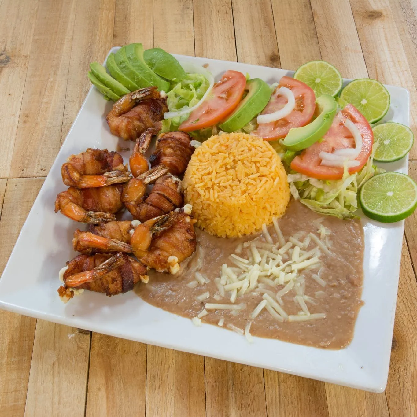 Grilled shrimp platter with rice and beans, a Mexican classic