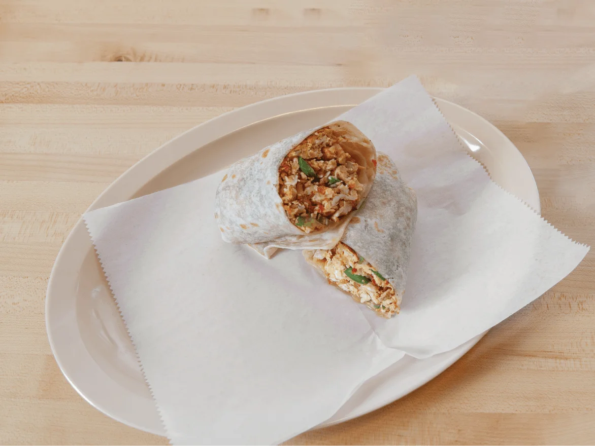 Delicious breakfast burrito with scrambled eggs