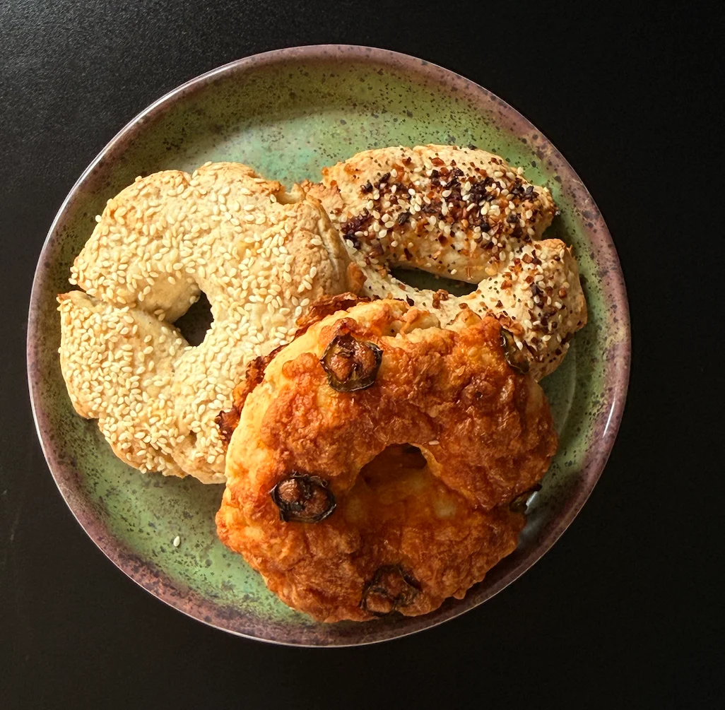 Assorted Korean savory pastries on a green plate