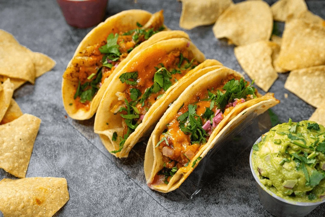 Authentic East Coast street tacos with crispy falafel, fresh pico de gallo, and soft corn tortillas, served with salsa, guacamole, rice, and chips. A must-try Brooklyn taco experience blending Latin and Mediterranean flavors