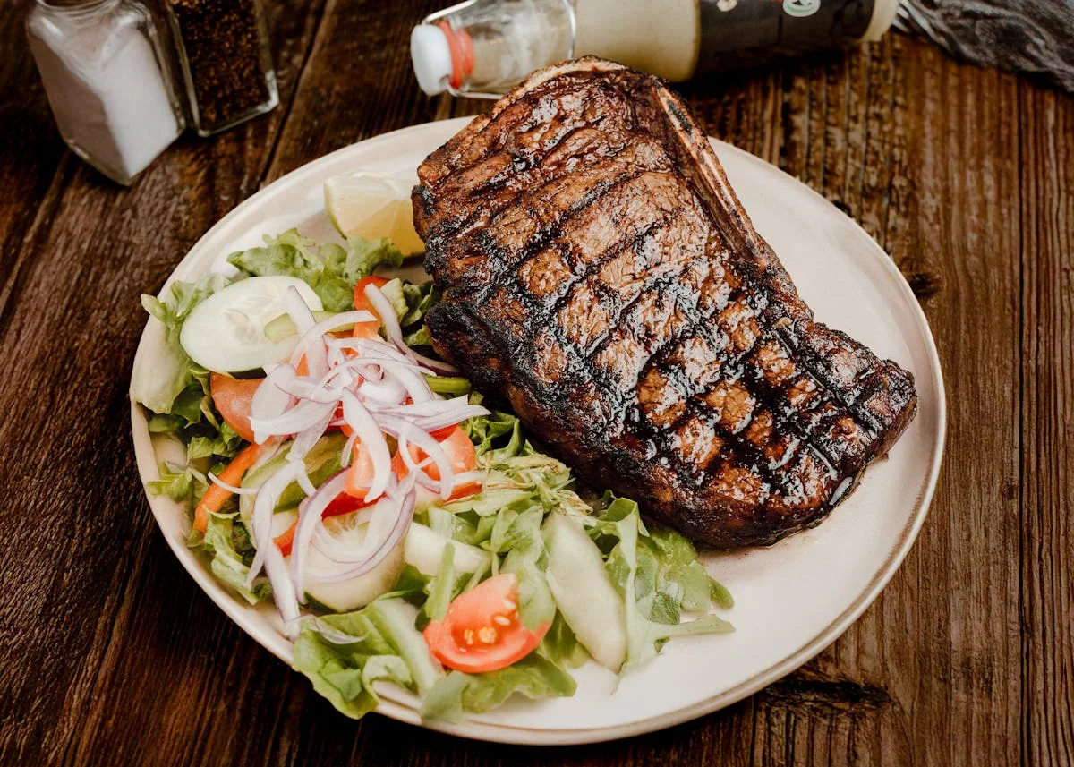 Grilled steak served with fresh garden salad
