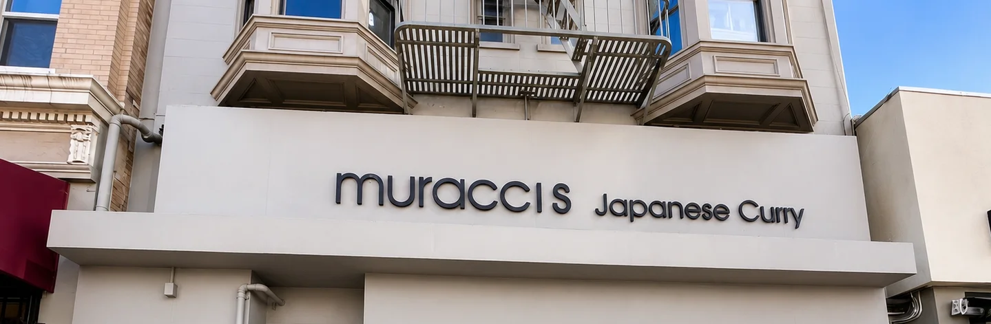 Exterior of Muracci's Japanese Curry restaurant with the main entrance and storefront signage in San Francisco.