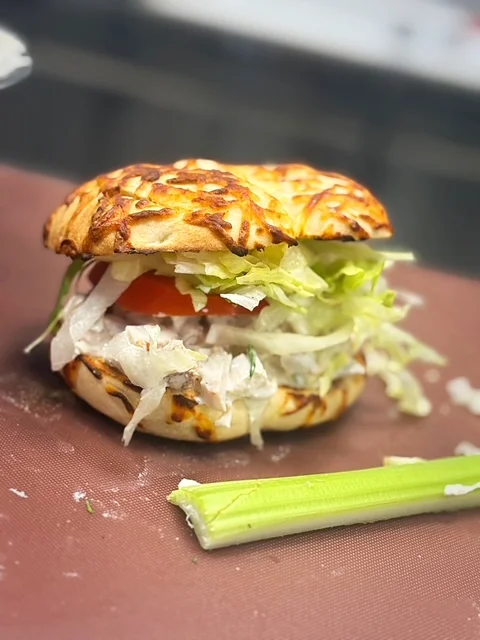 Delicious gourmet burger with fresh toppings on a wooden table