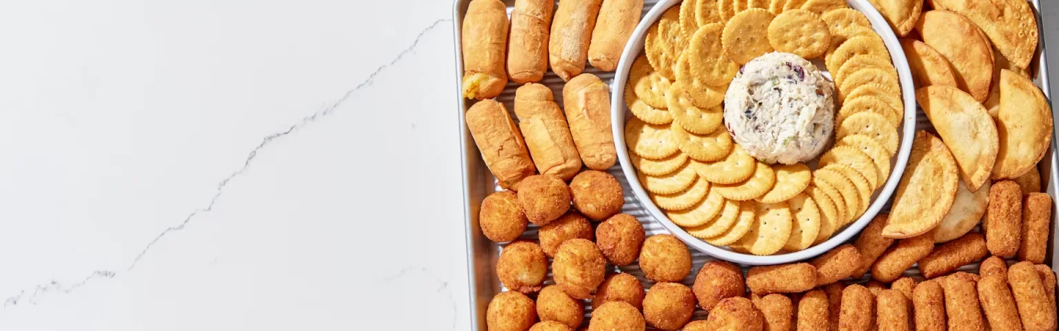 Assorted appetizer platter with cheese ball and crackers