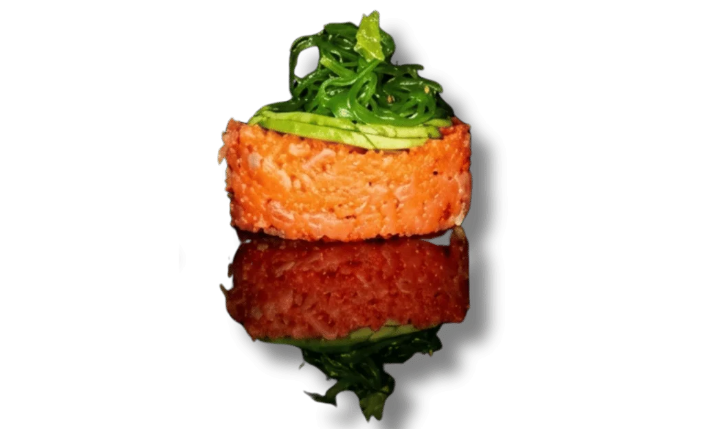 Sushi with spicy tuna and green toppings on a reflective surface.