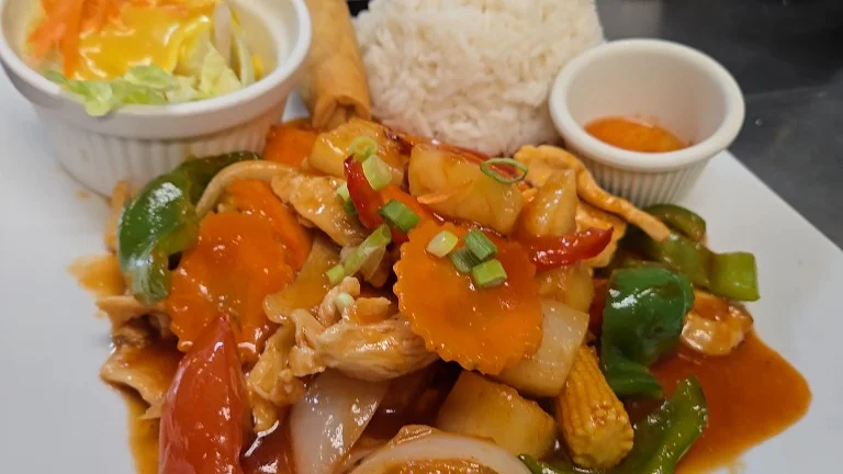 Szechuan chicken stir-fry with vegetables and rice