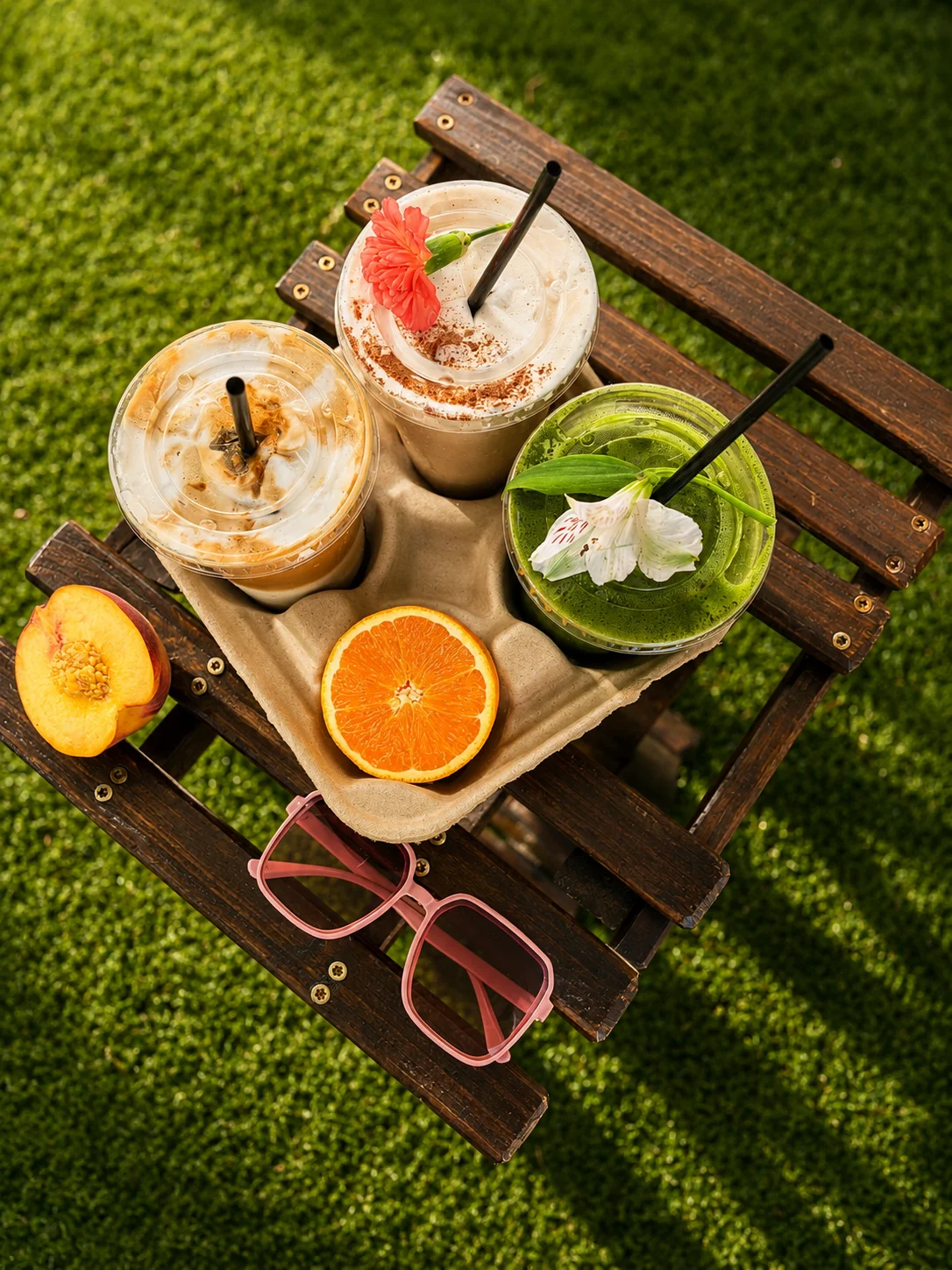 Refreshing summer drinks on a wooden tray