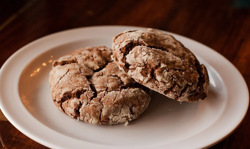 Chocolate crinkle cookies on a white plate