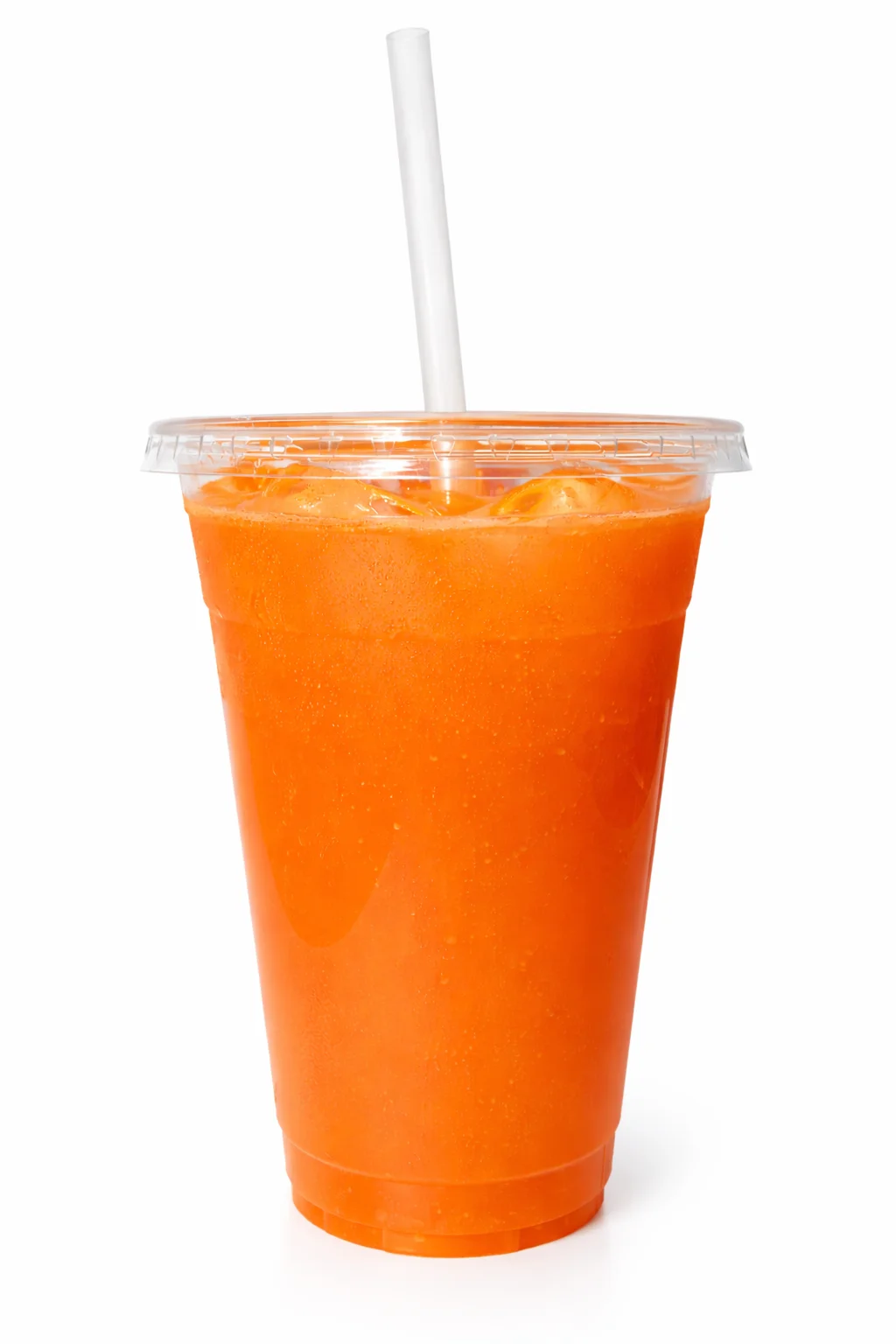A transparent cup filled with a vibrant orange drink, featuring ice cubes and a straw, perfect for a refreshing beverage.