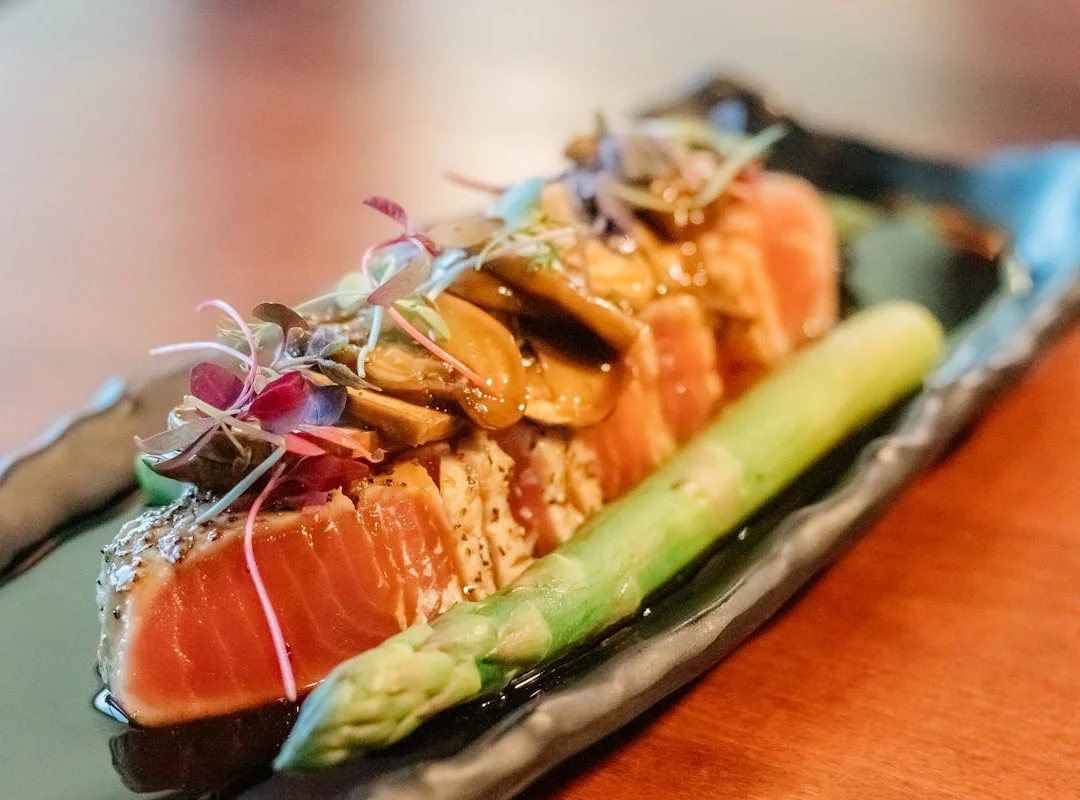 cartoon image man holding sushi plates