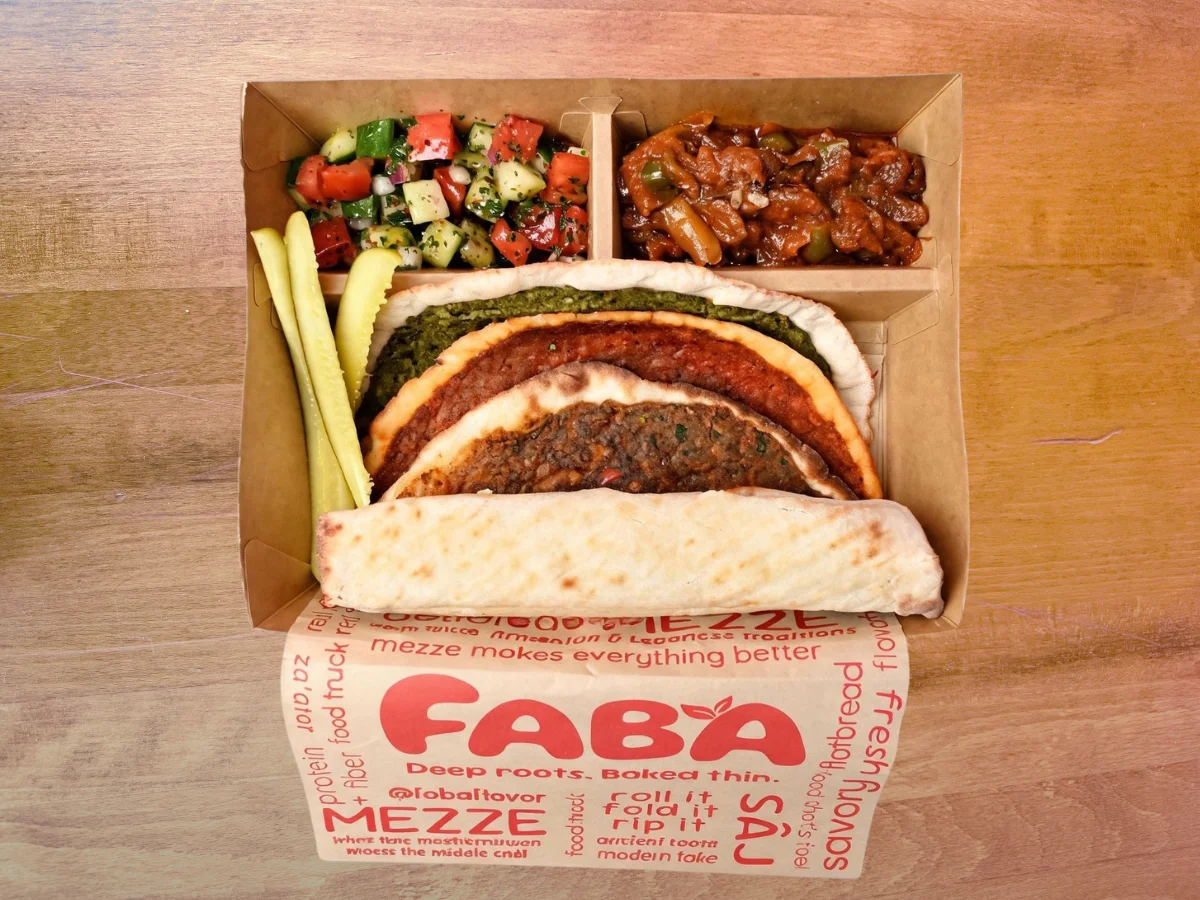 Middle Eastern mezze platter with flatbreads and fresh salad