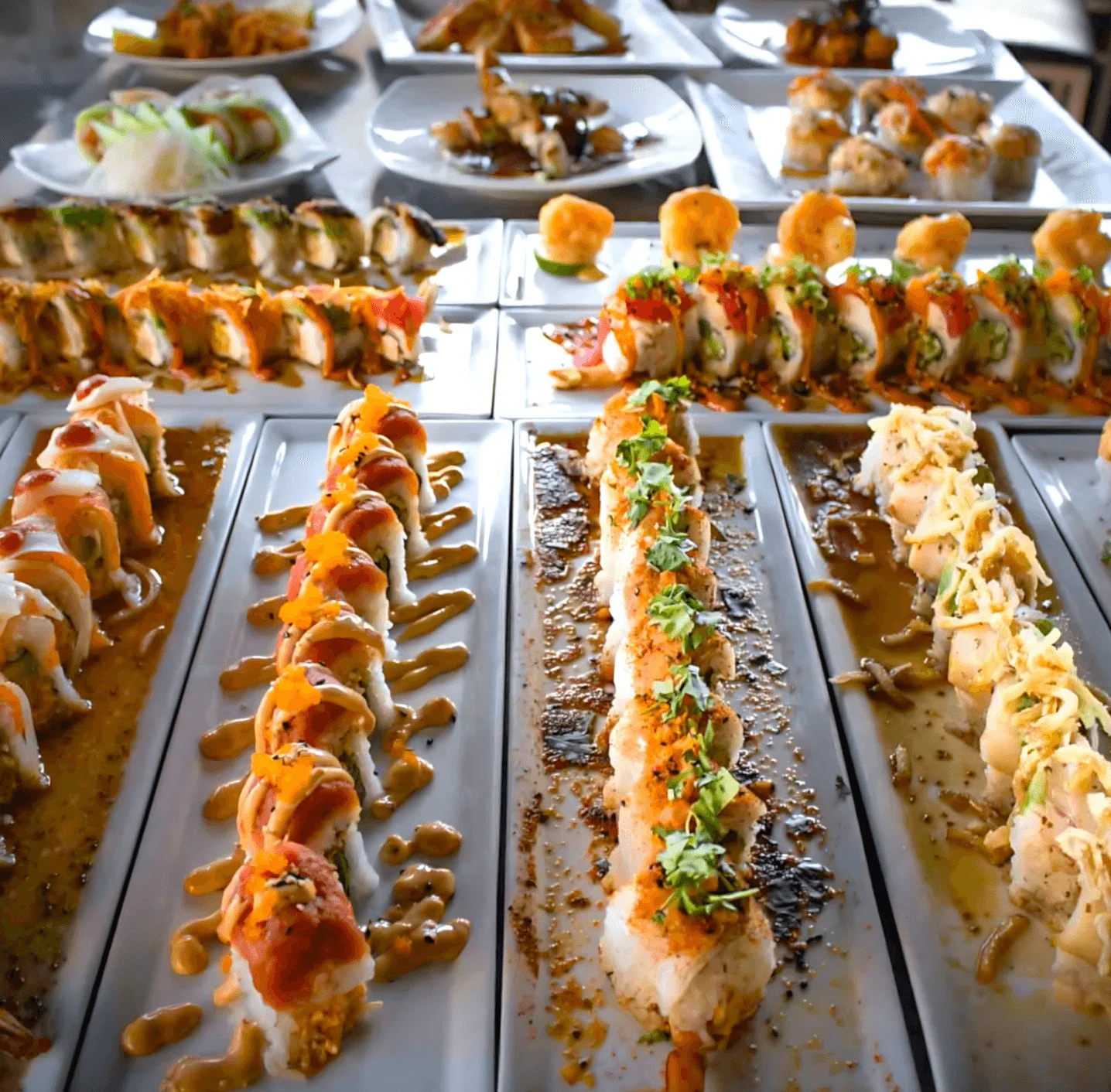 Assorted sushi rolls on elegant platters
