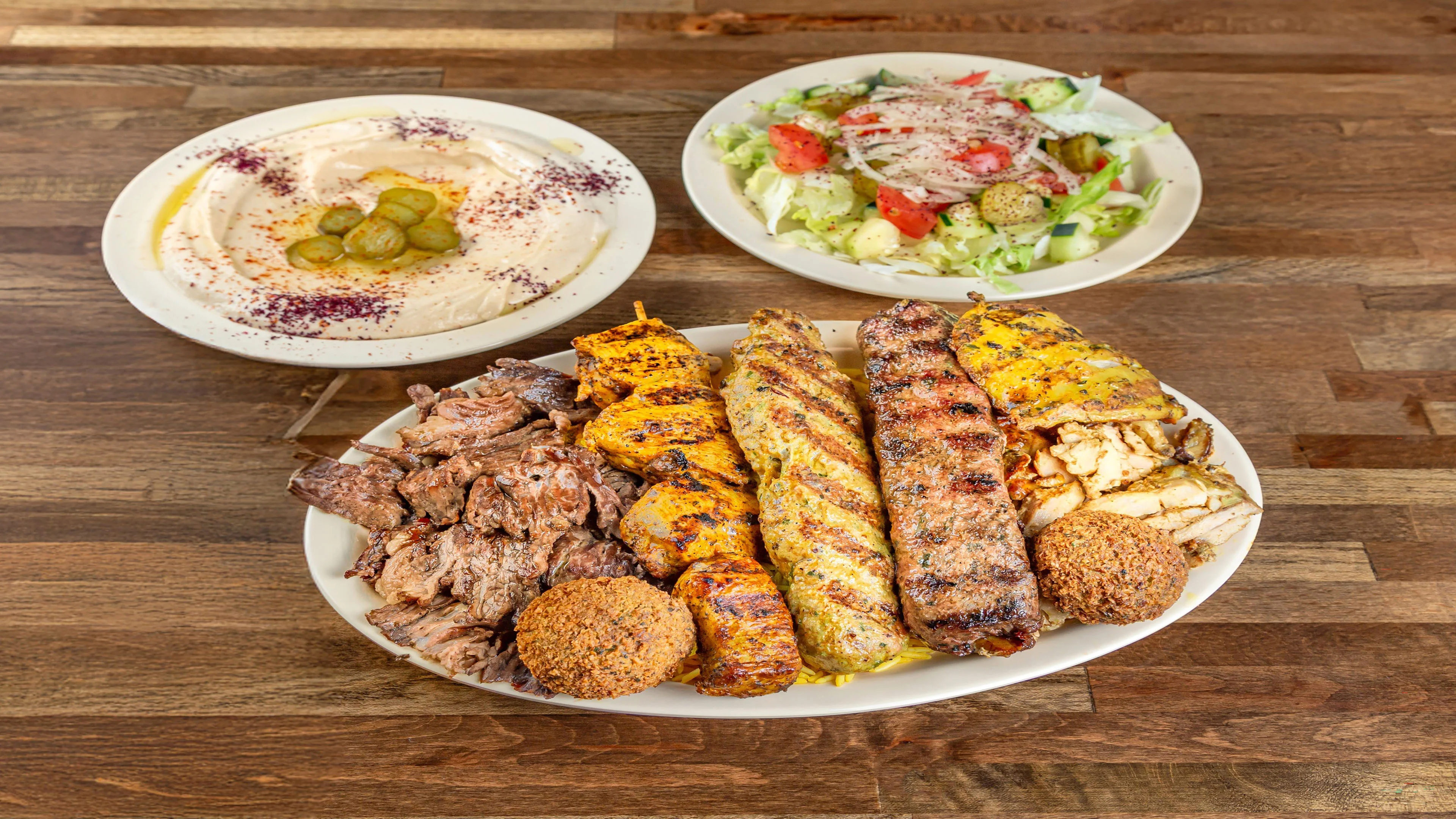 Pita Zone grilled meats with rice, hummus, and salad