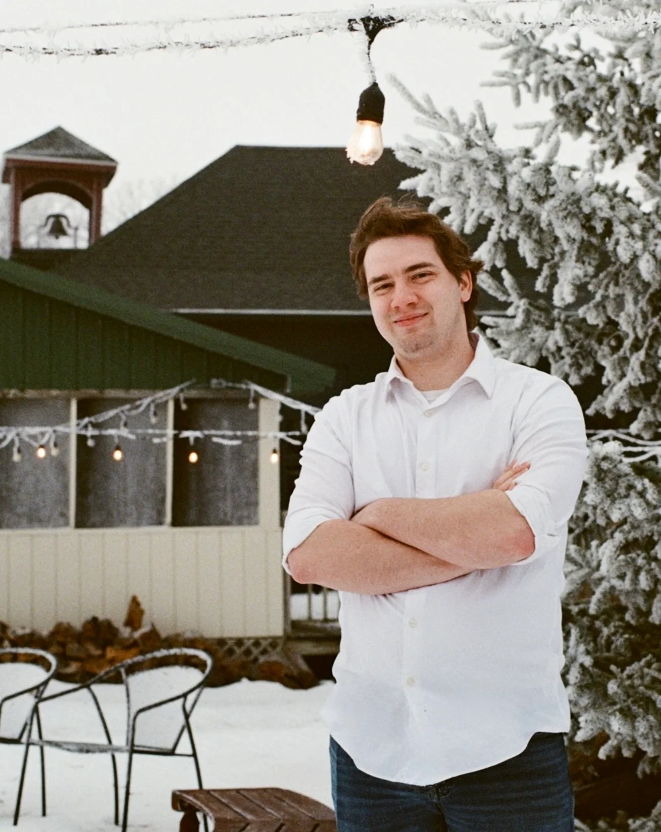 Restaurant staff member outdoors in a snowy winter setting