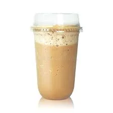 Iced coffee beverage in a clear cup with frothy top