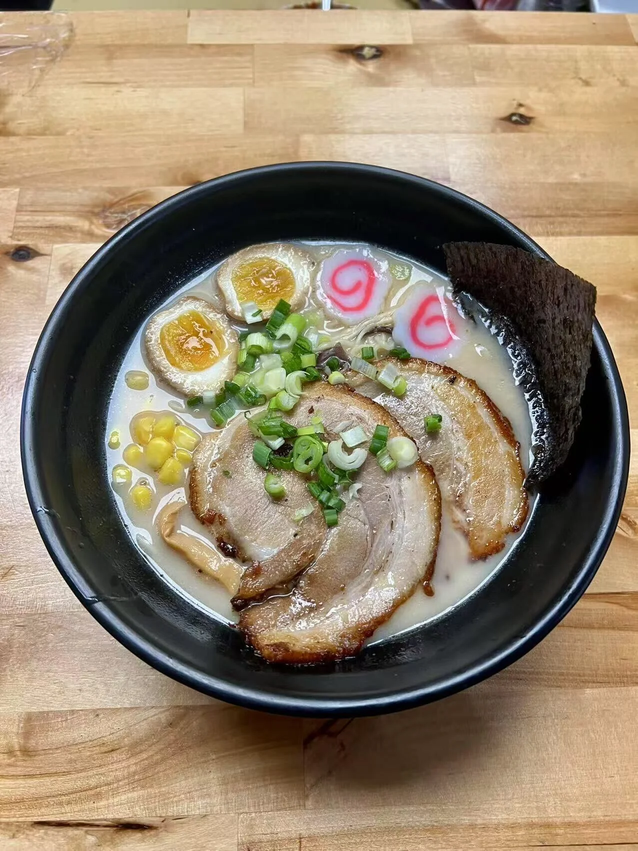 Japanese tonkotsu ramen topped with chashu pork and soft-boiled eggs