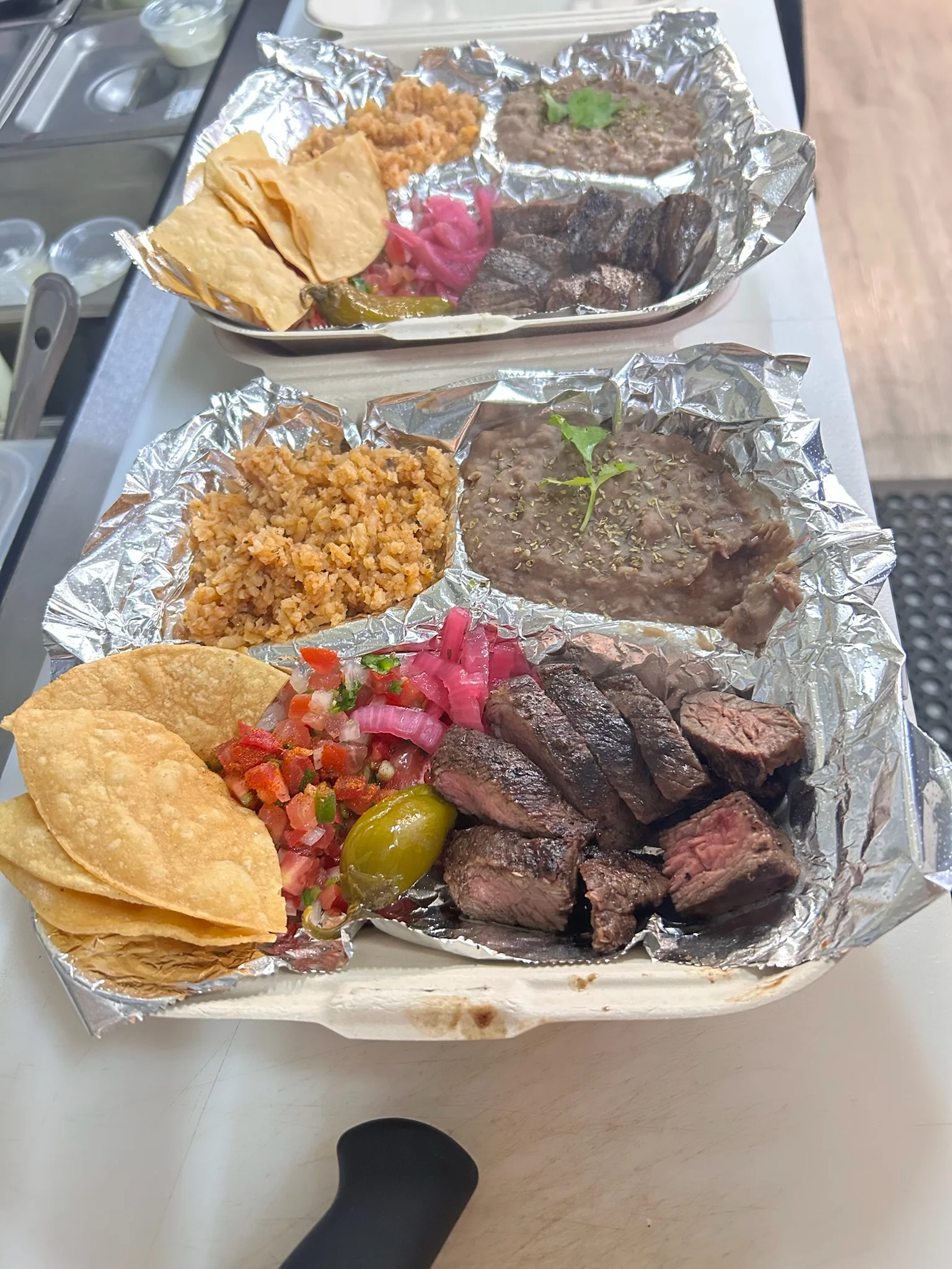 Authentic Mexican carne asada platter with sides