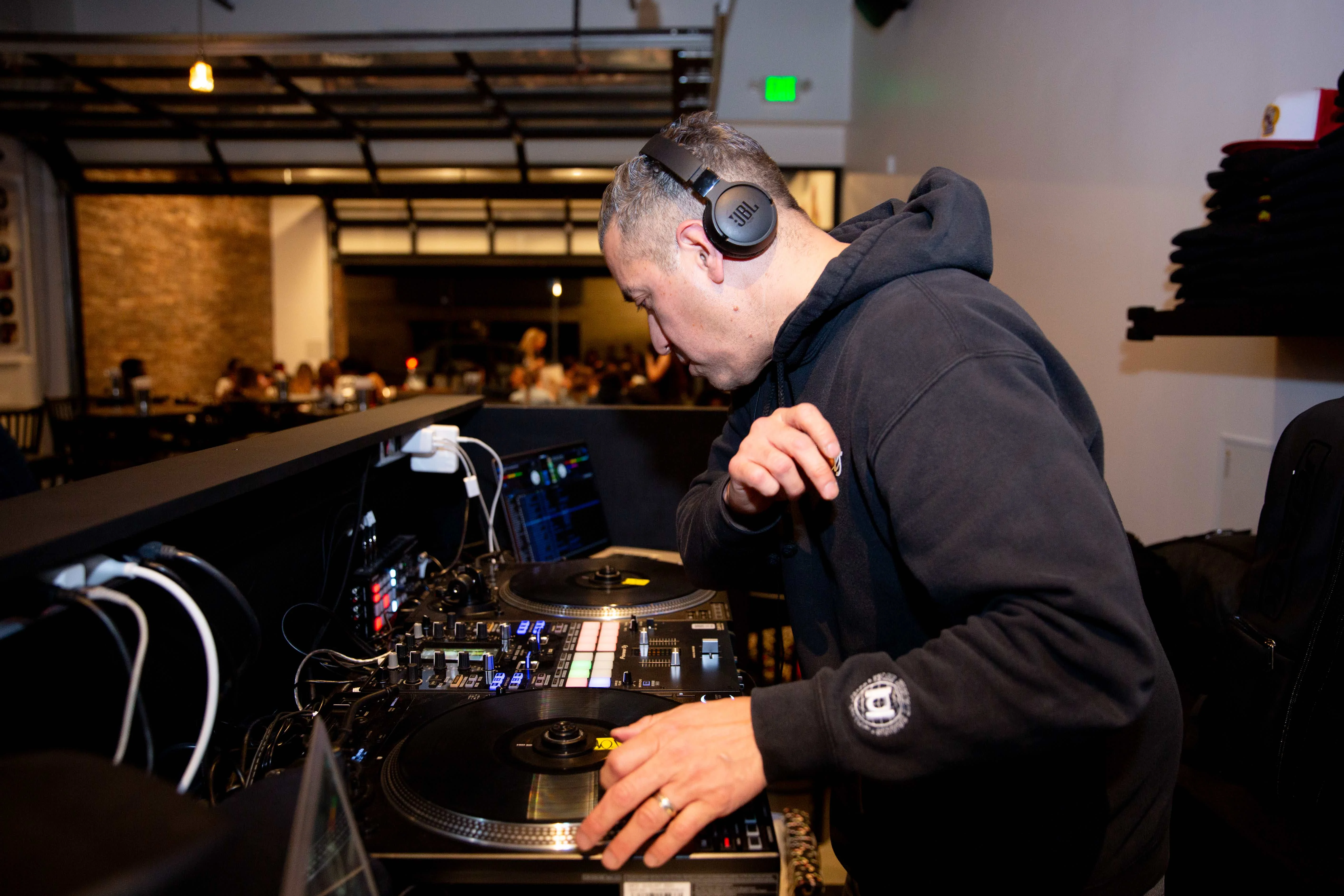 DJ performing live at a vibrant restaurant event