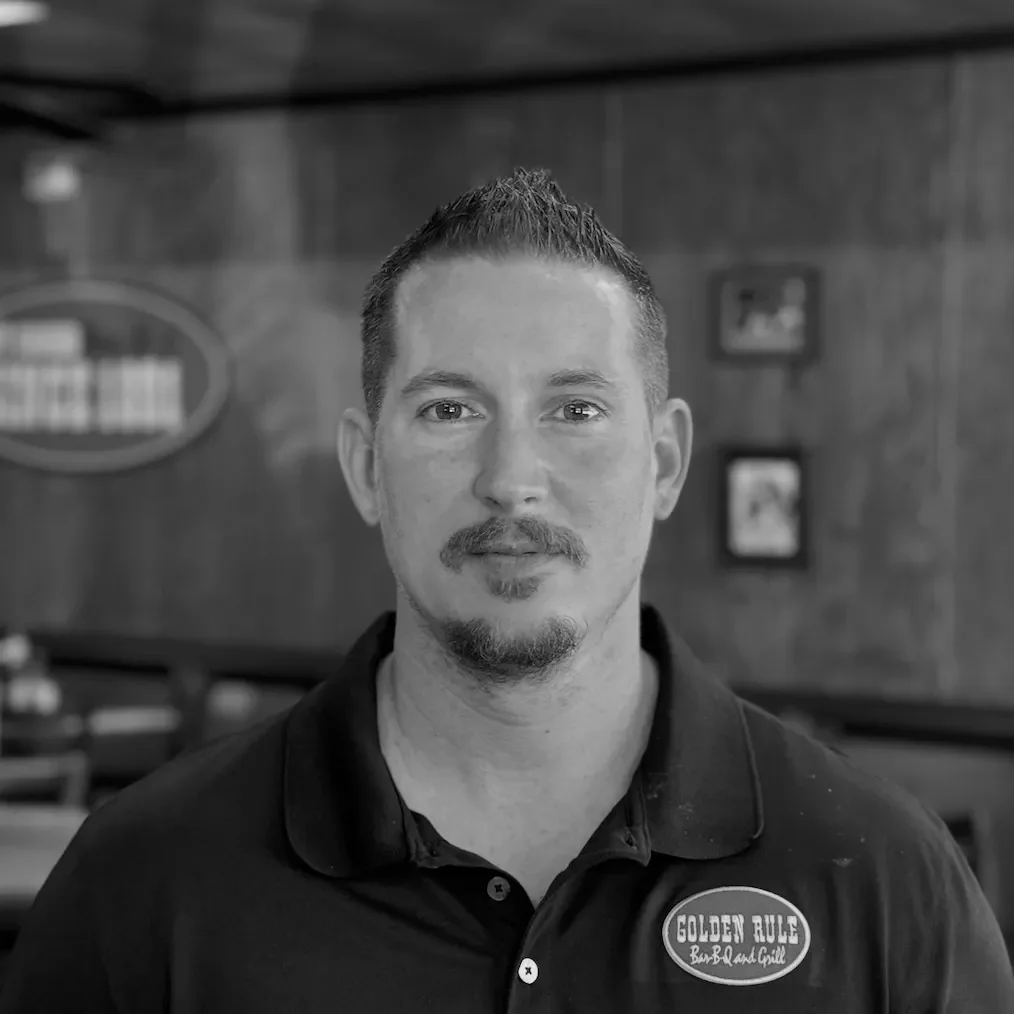 Portrait of a restaurant staff member at Golden Rule Bar BQ and Grill