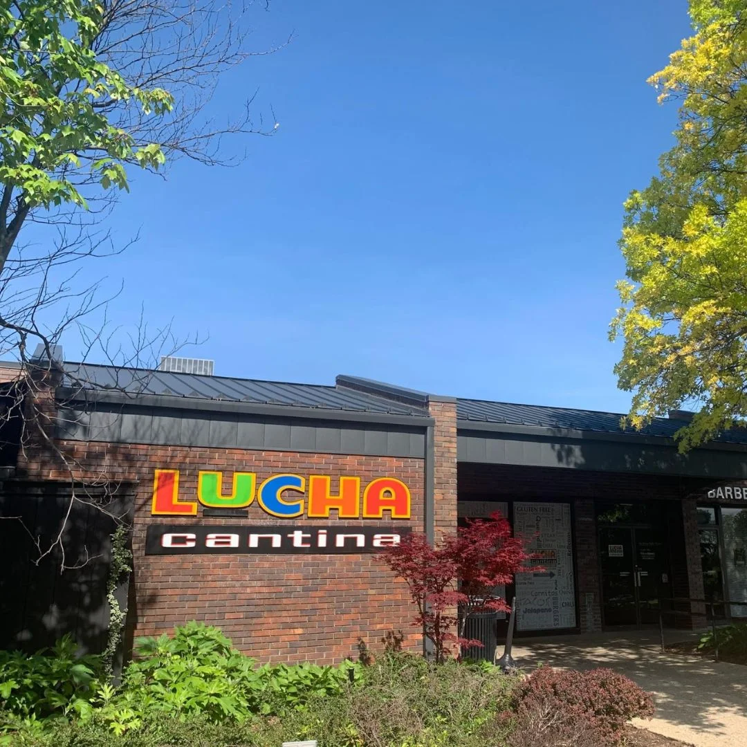 Exterior view of Lucha Cantina restaurant with colorful signage