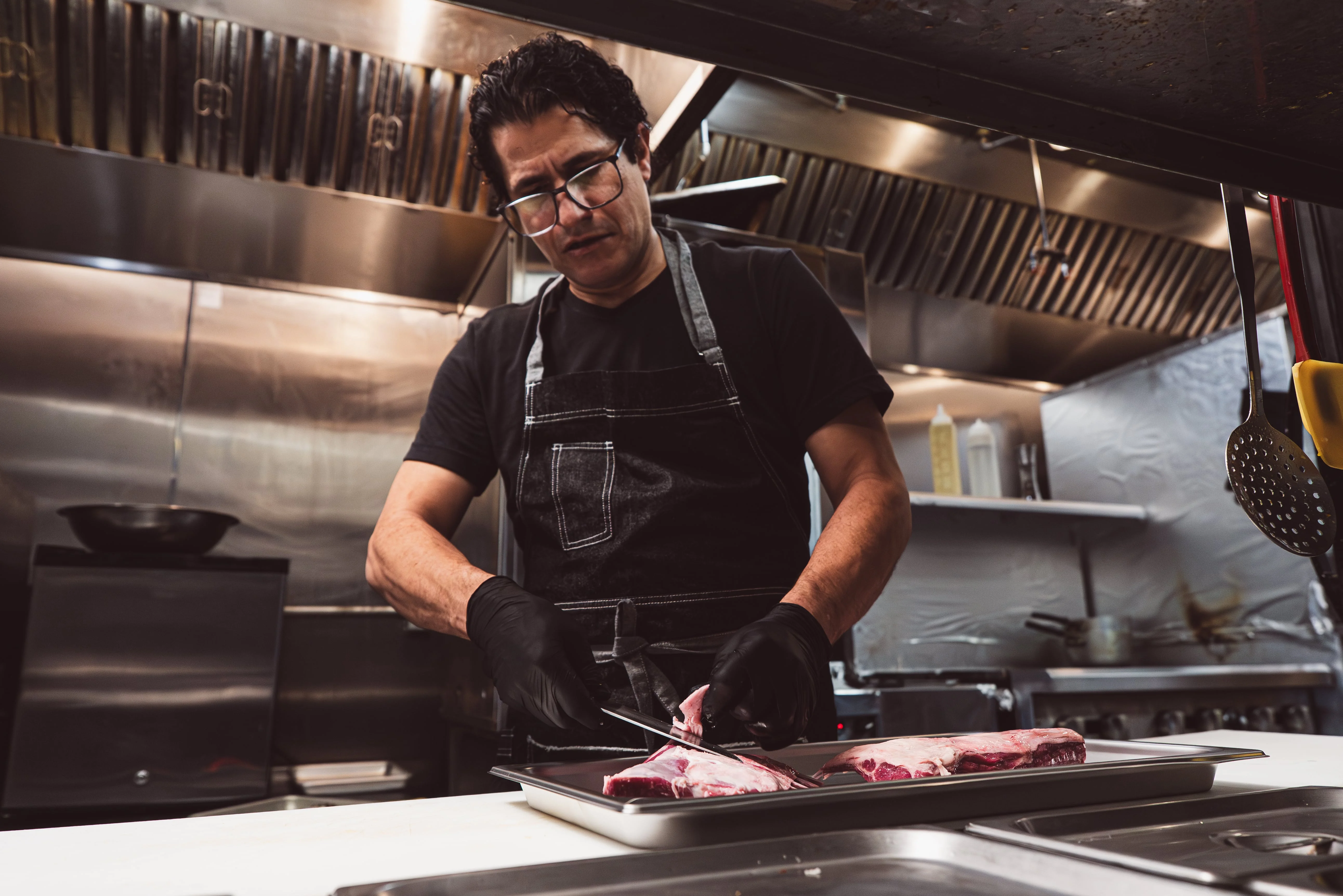 A restaurant chef preparing a dish