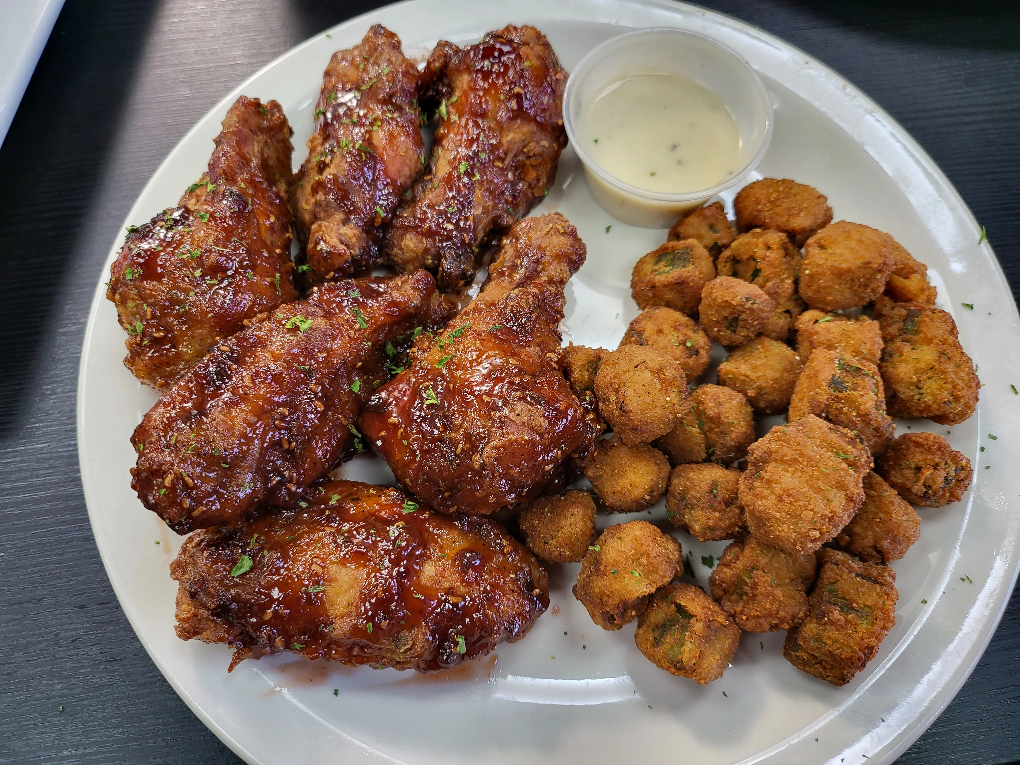 Crispy Southern fried chicken wings with fried okra